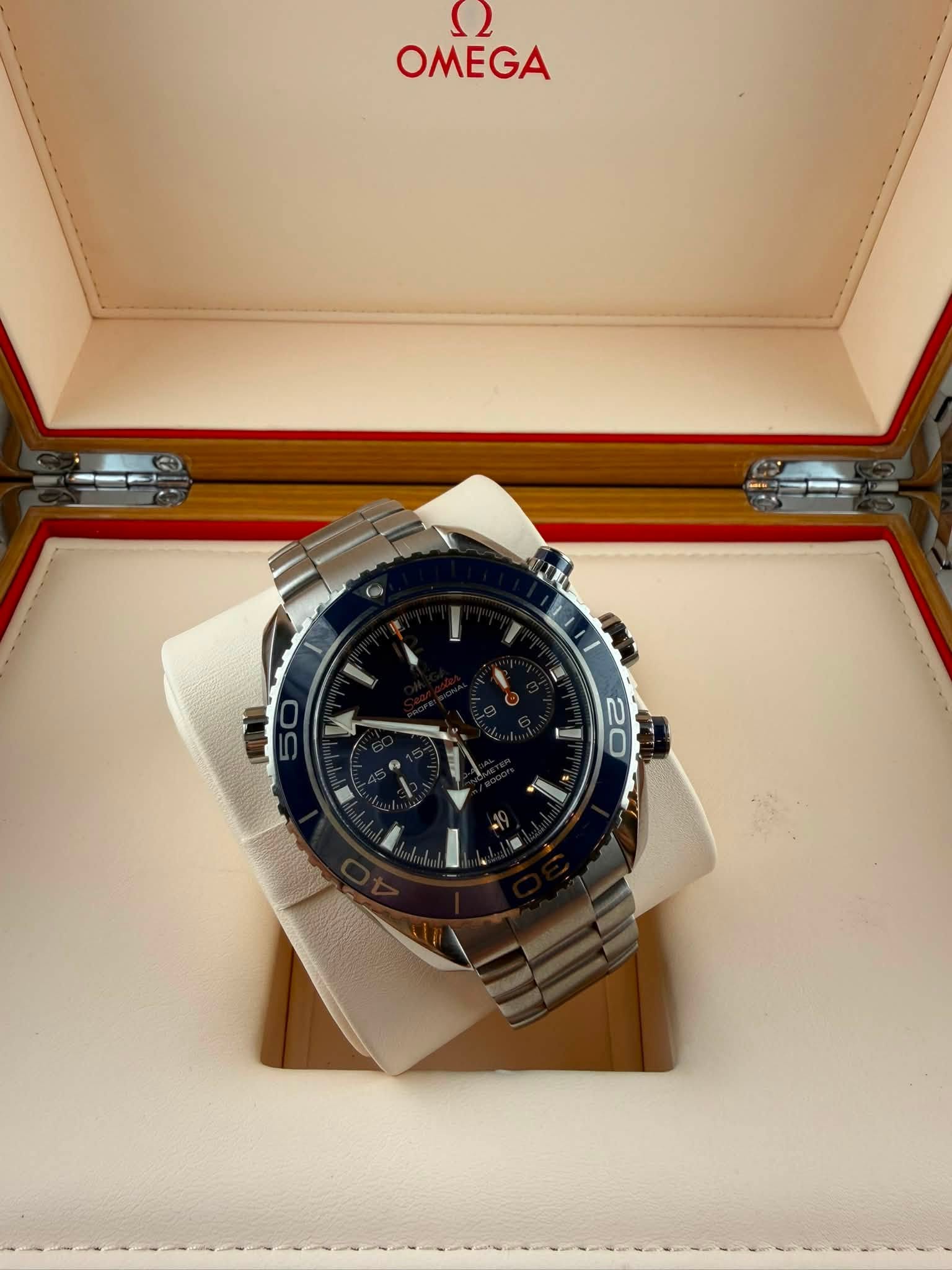 May be an image of wrist watch and text that says 'ع OMEGA 0 20'