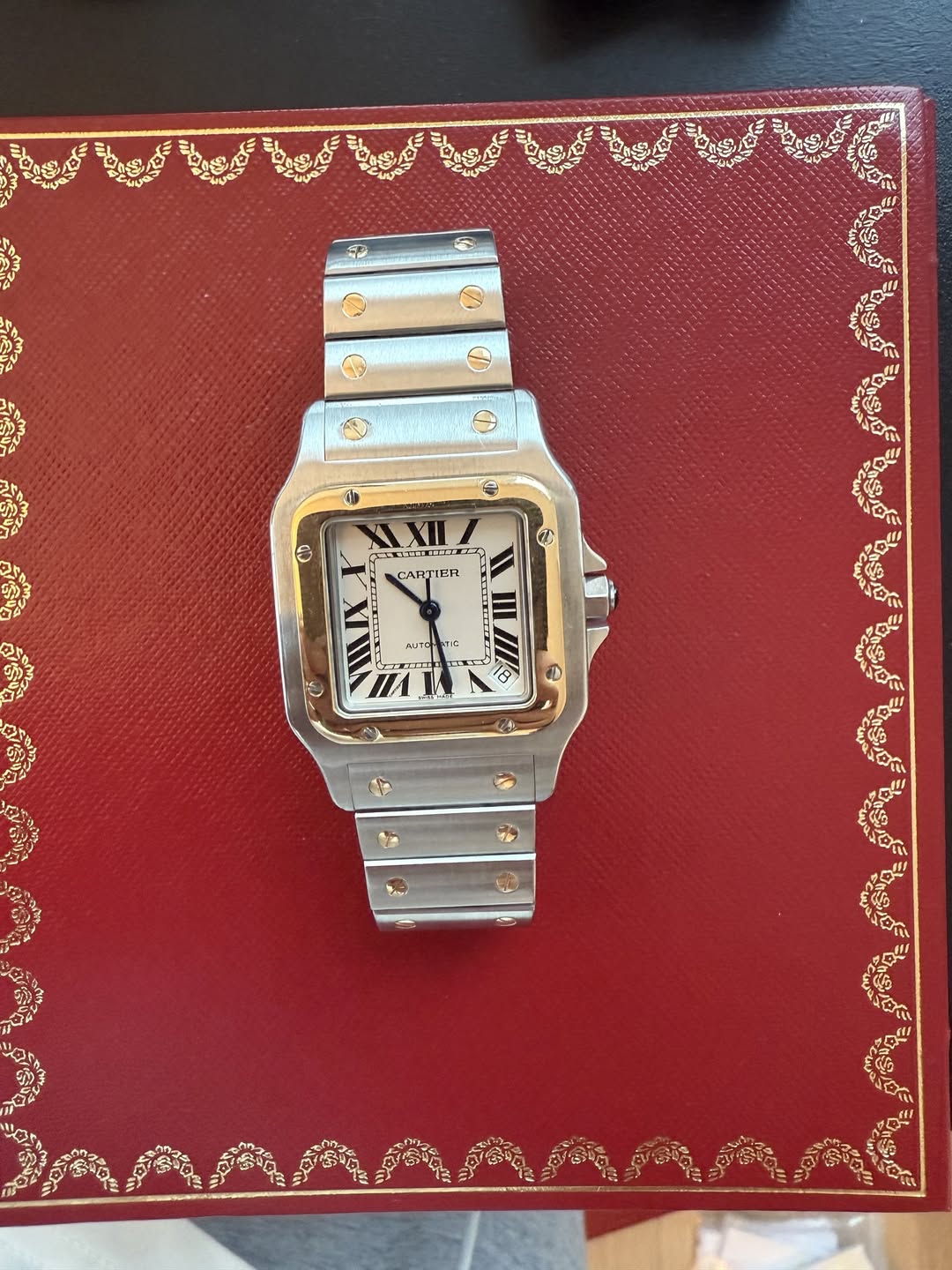 May be an image of wrist watch and text