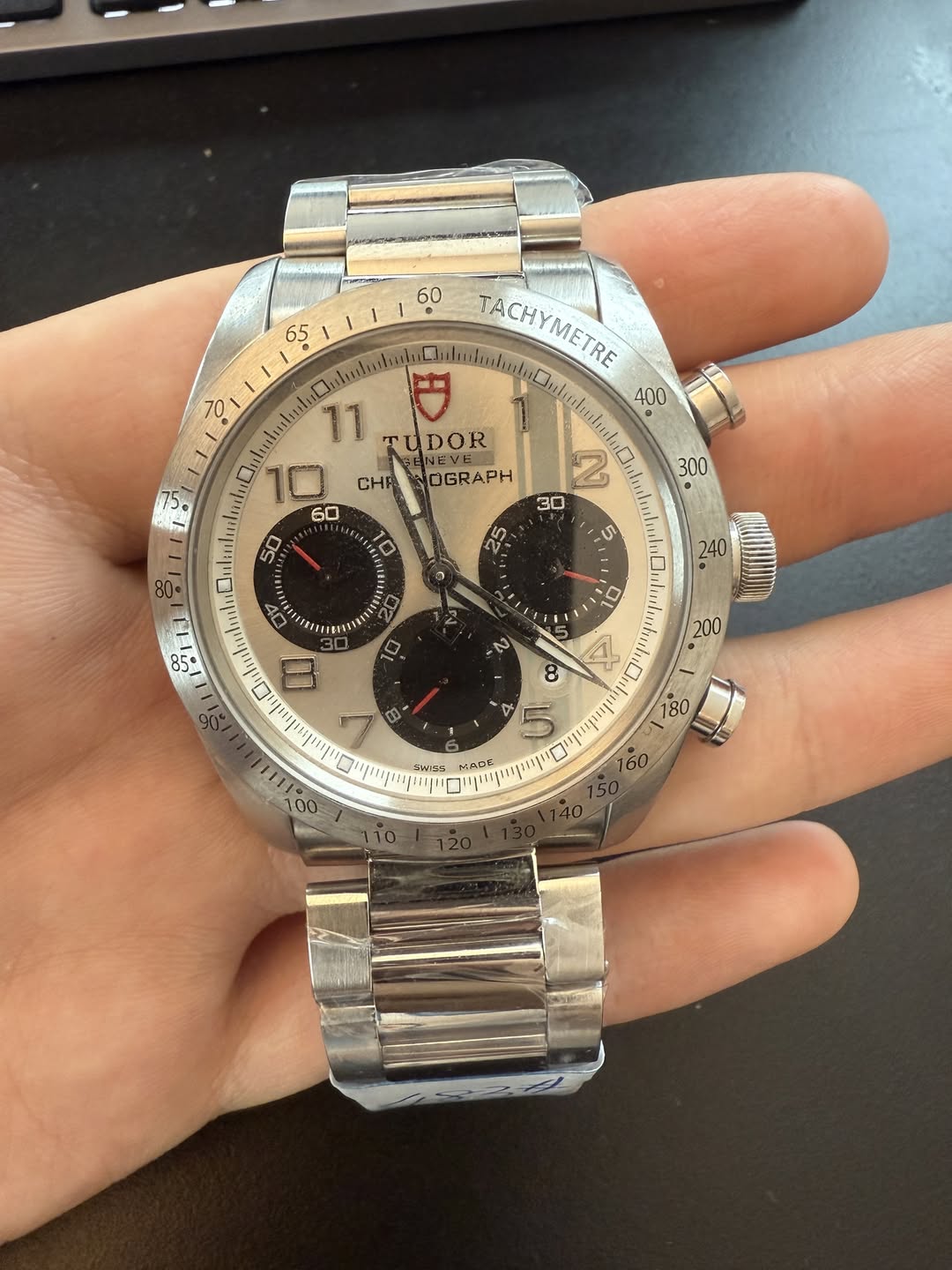 May be an image of wrist watch and text