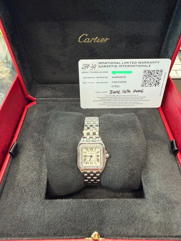 May be an image of wrist watch and text that says 'Cartier ERNATIONAL LIMITED WARRANTY GARANTIE INTERNATIONALE SERIAL HUMERO SERIE REFERENCE RETERENCE/REFERENCE REFERENCE REFERENCE…
