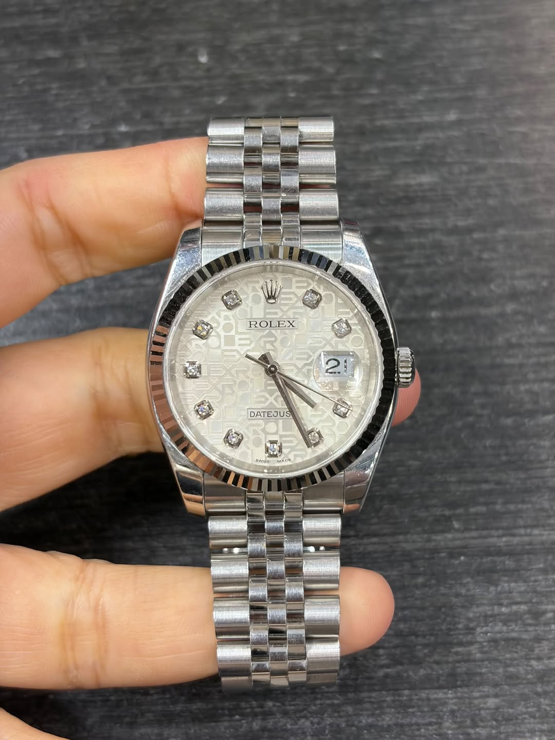 May be an image of wrist watch and text