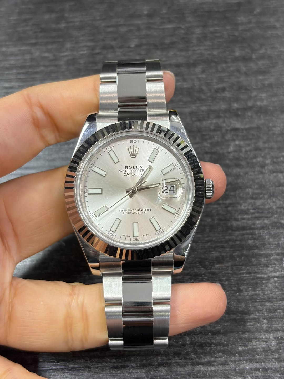 May be an image of wrist watch and text