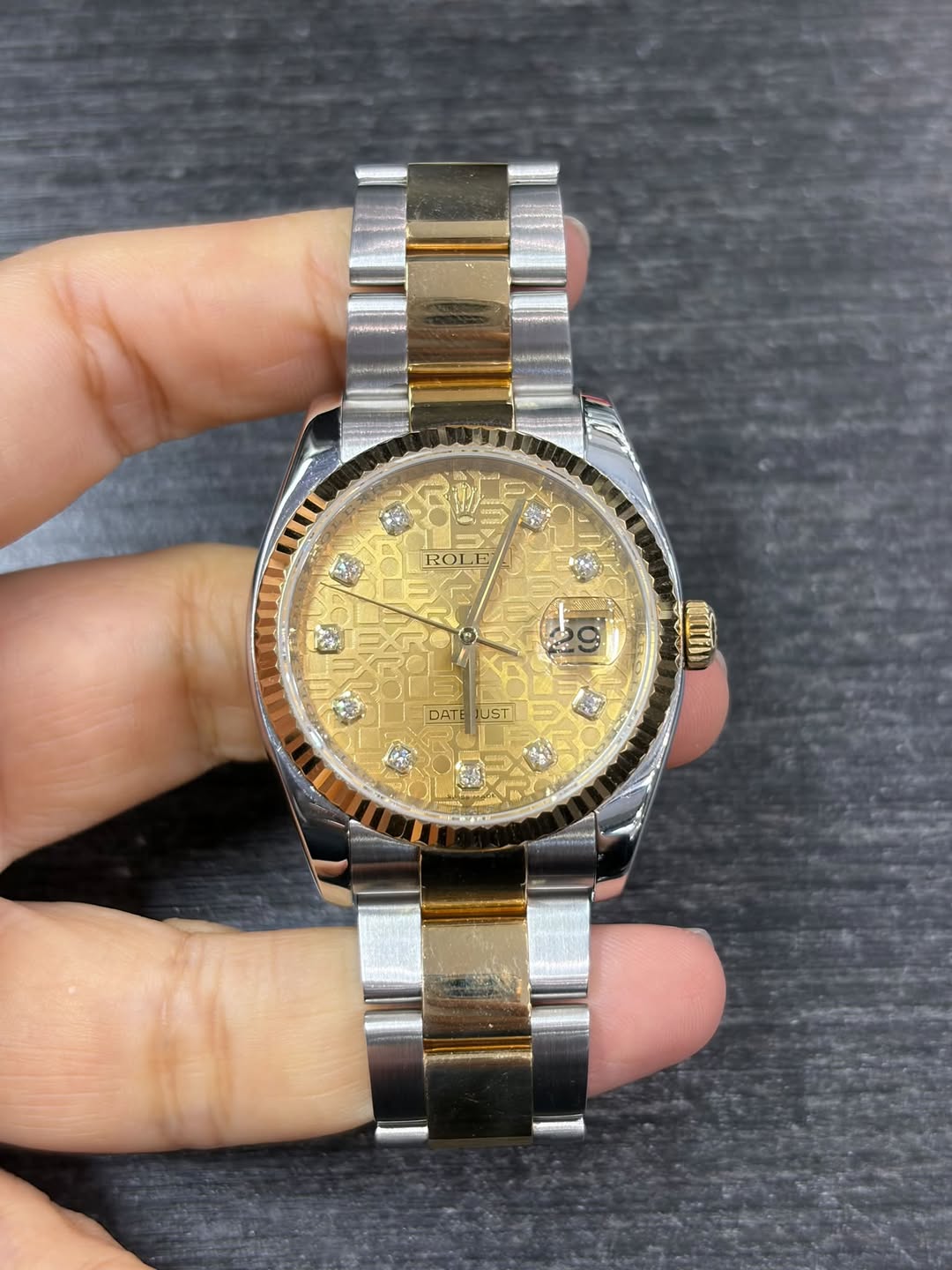May be an image of wrist watch and text