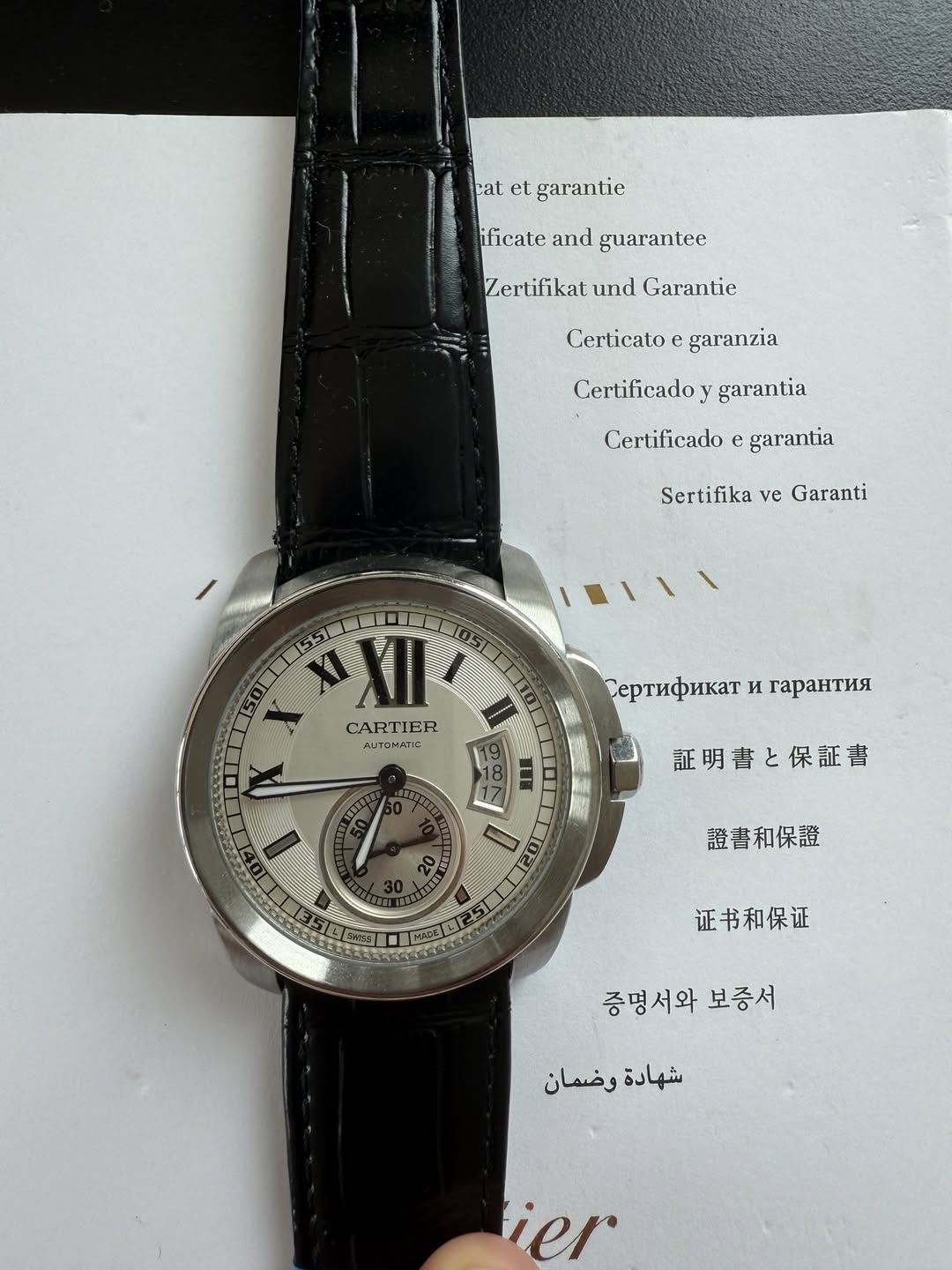 May be an image of wrist watch and text that says 'calelgarantie cat et garantie ificate and guarantee Zertifikat.und und Garantie Certicato garanzia Certificado garantia…