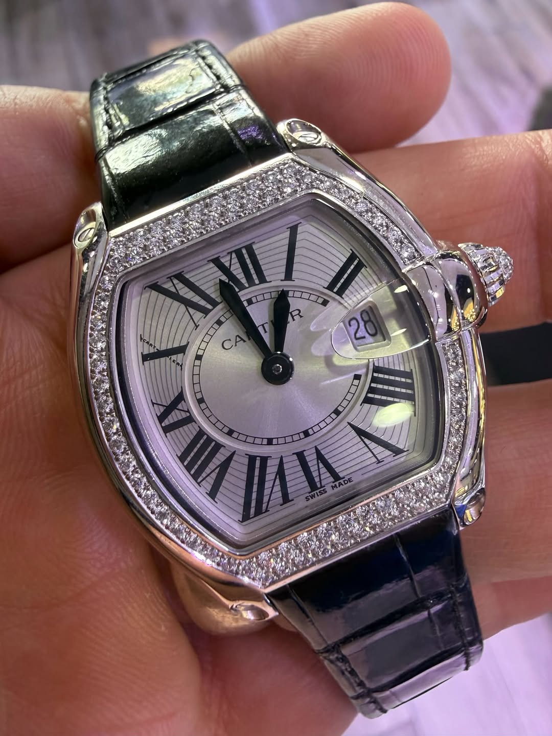 May be an image of wrist watch and text