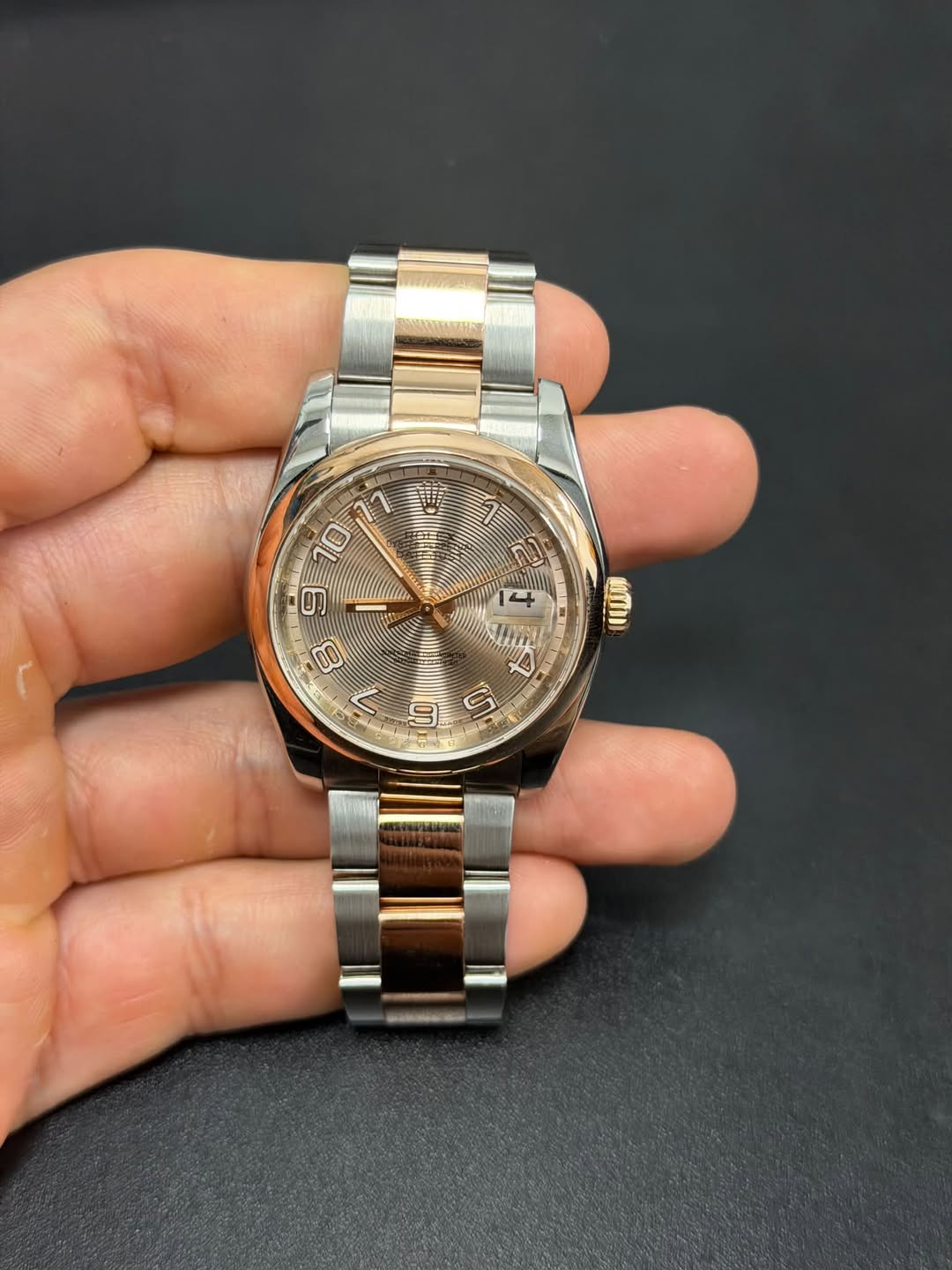 May be an image of wrist watch and text