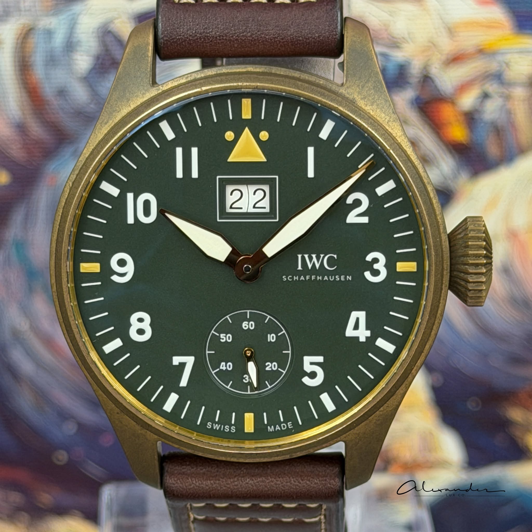 May be an image of wrist watch and text that says 'IO 22 2 9 IWC SCHAFFHAUSEN AUSEN M4111131 SWISS MADE'
