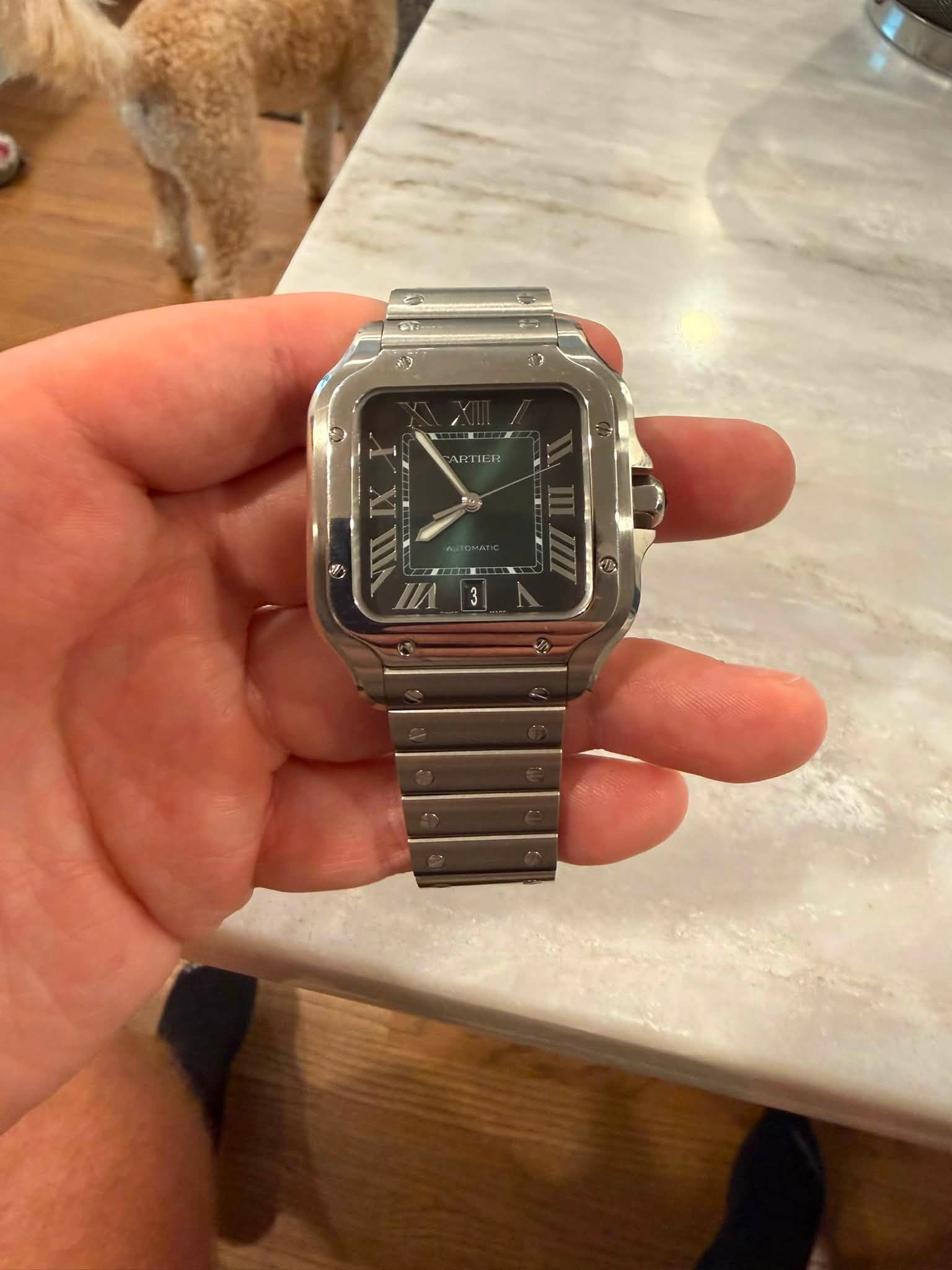 May be an image of digital watch, timer and text