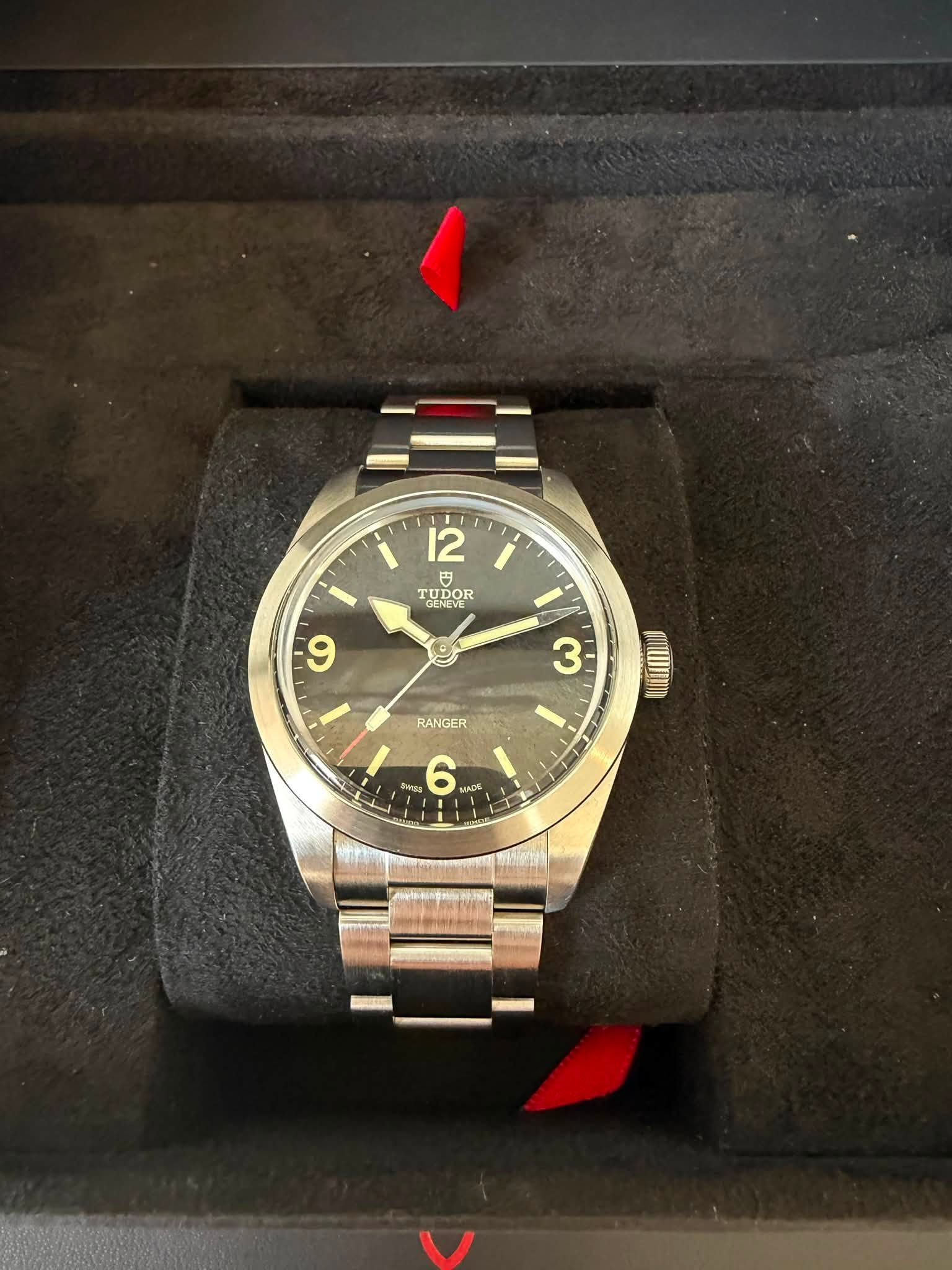May be an image of wrist watch and text