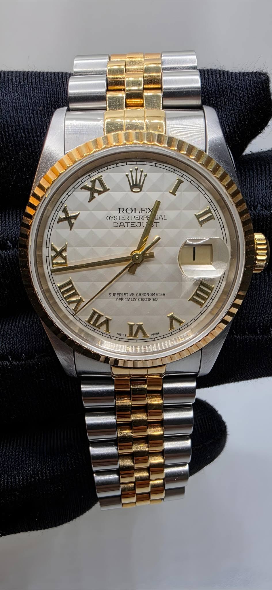 May be an image of wrist watch and text