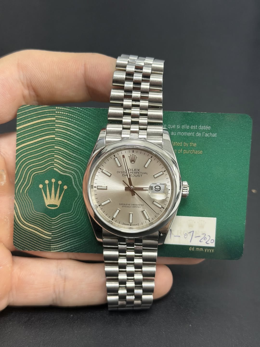 May be an image of wrist watch and text
