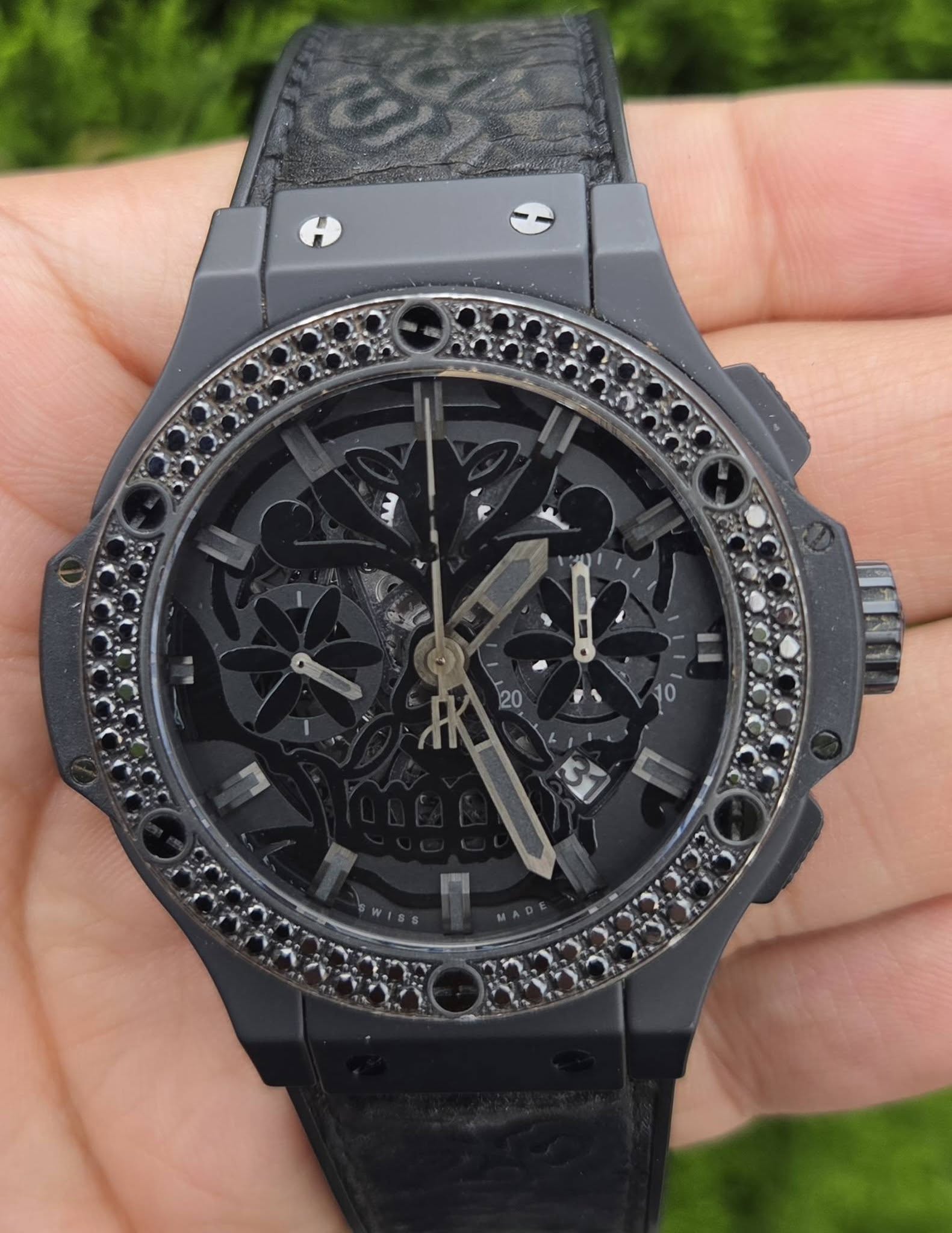 May be an image of wrist watch and text