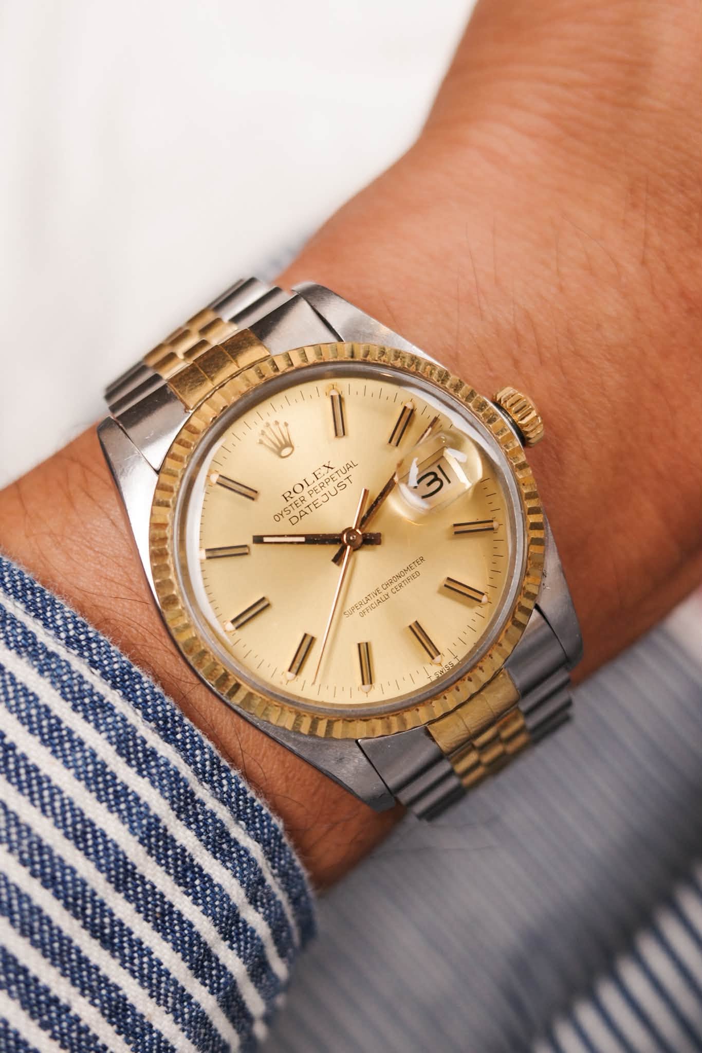 May be an image of wrist watch and text