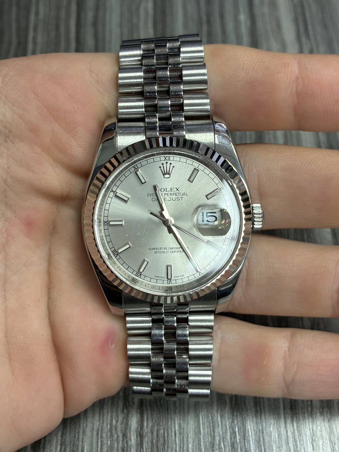 May be an image of wrist watch and text