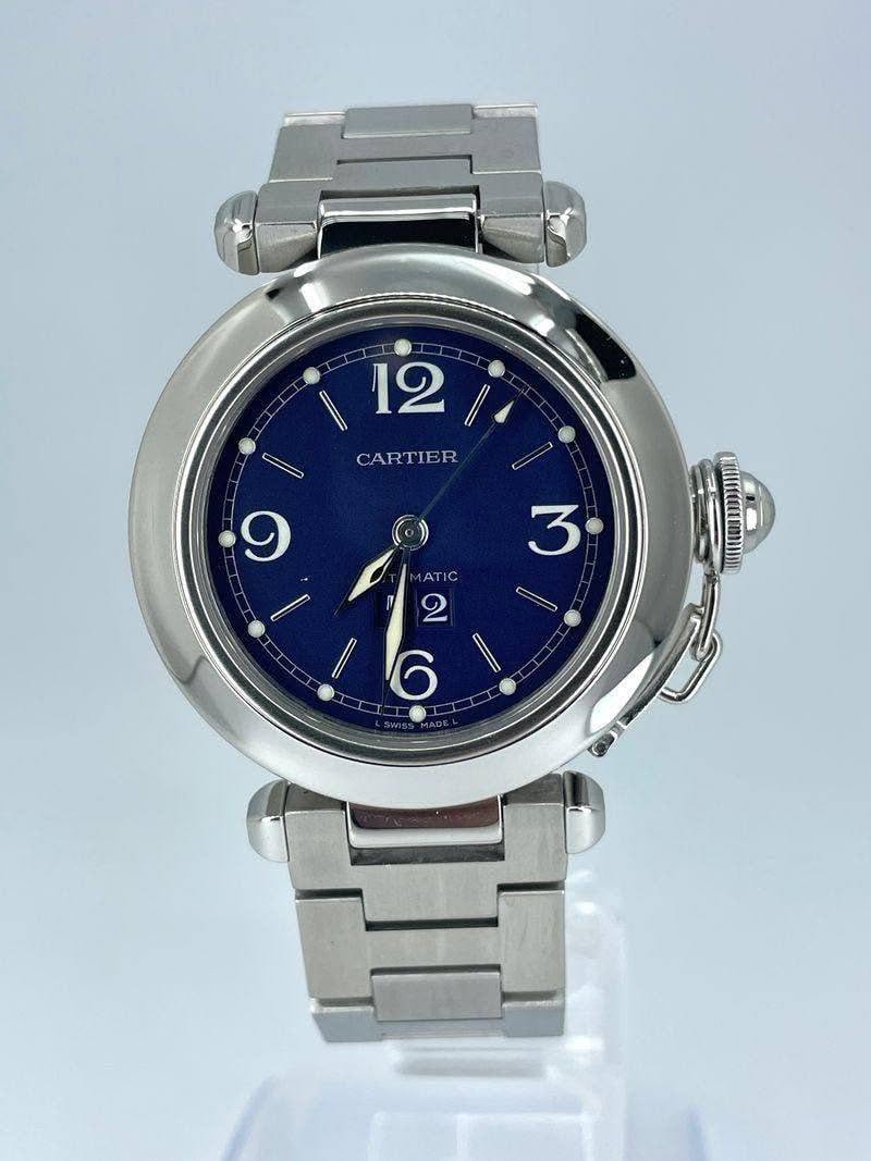 May be an image of digital watch and text that says '12 CARTIER C 9 () 3 C 1AT ATIC IC 2 II 6'