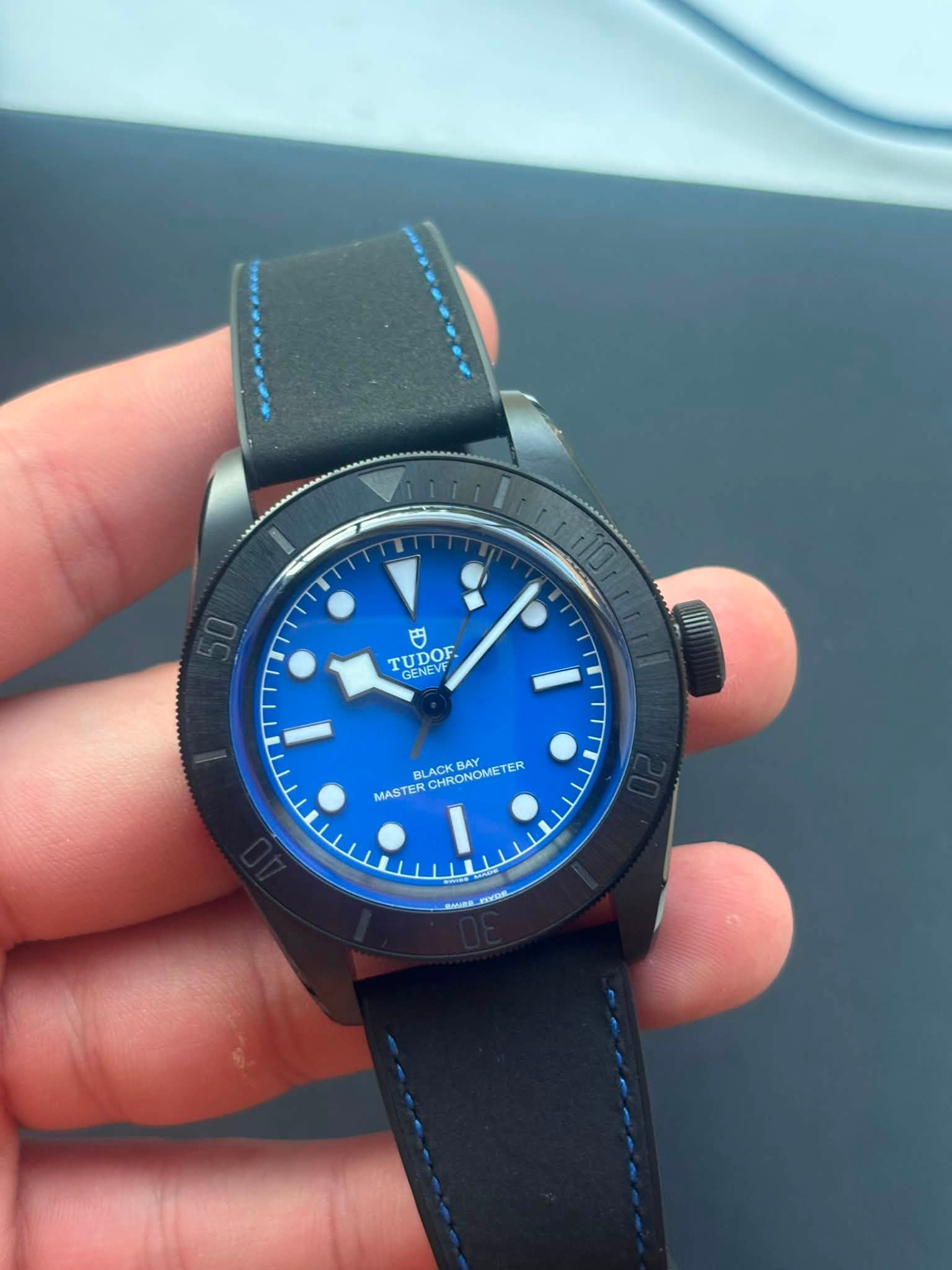 May be an image of wrist watch and text that says '円 ODOF GENEVF GENEVT BLACK CHRONOMETER MASTERCHRONOMETER CHRONOME TER BLACK MASTER SADE'