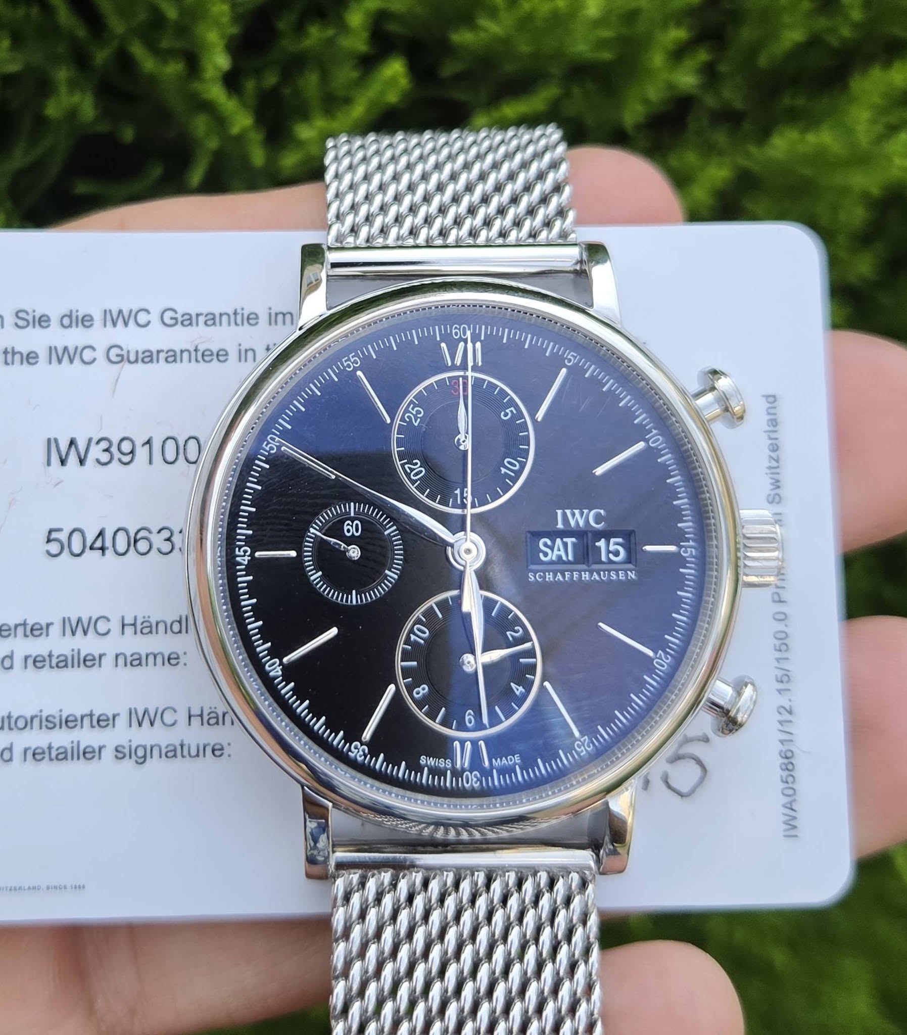 May be an image of wrist watch and text that says 'Sie die IWC Garantie im, the IWC Guarantee in 60 55 23 IW39100 5 لع a erter IWC Händl d retailer name: IWC SAT 15 SCHAFFHAUSEN…