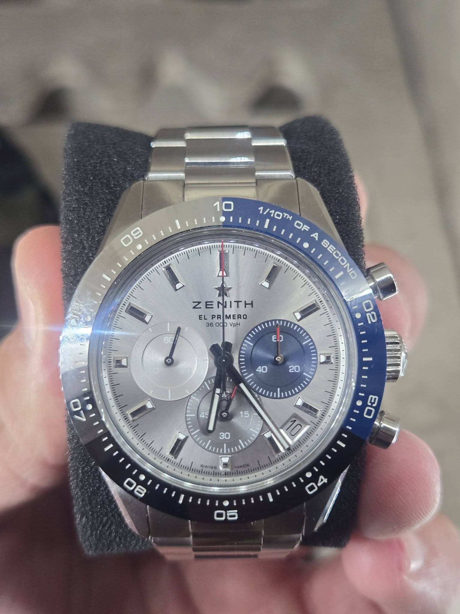 May be an image of wrist watch and text