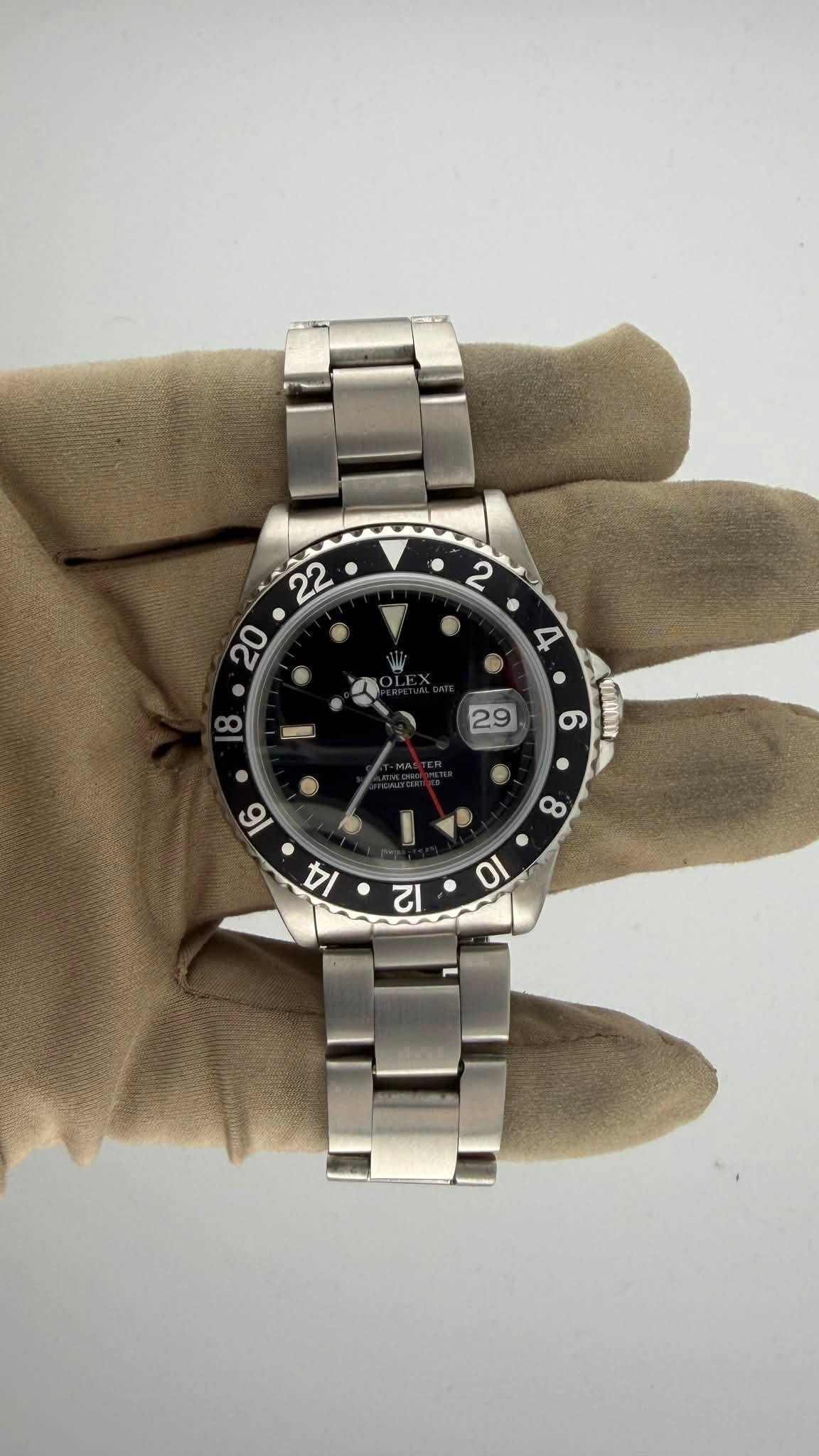 May be an image of wrist watch and text
