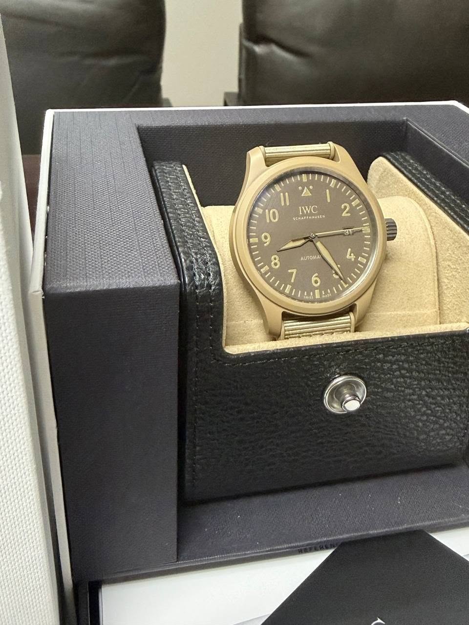 May be an image of wrist watch and text