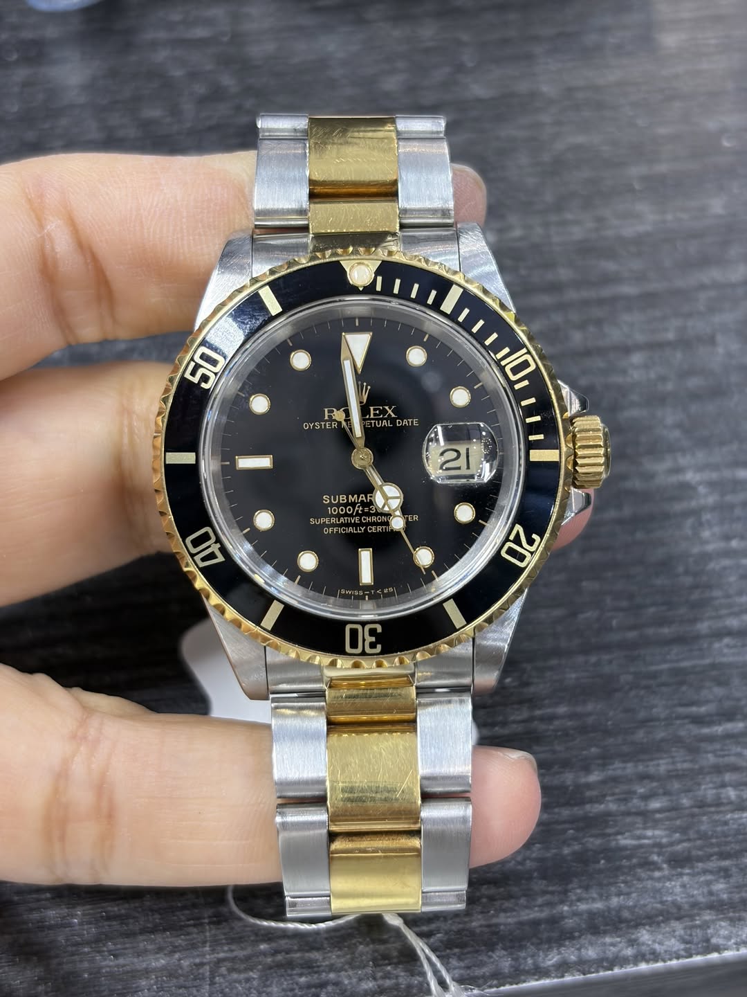 May be an image of wrist watch and text