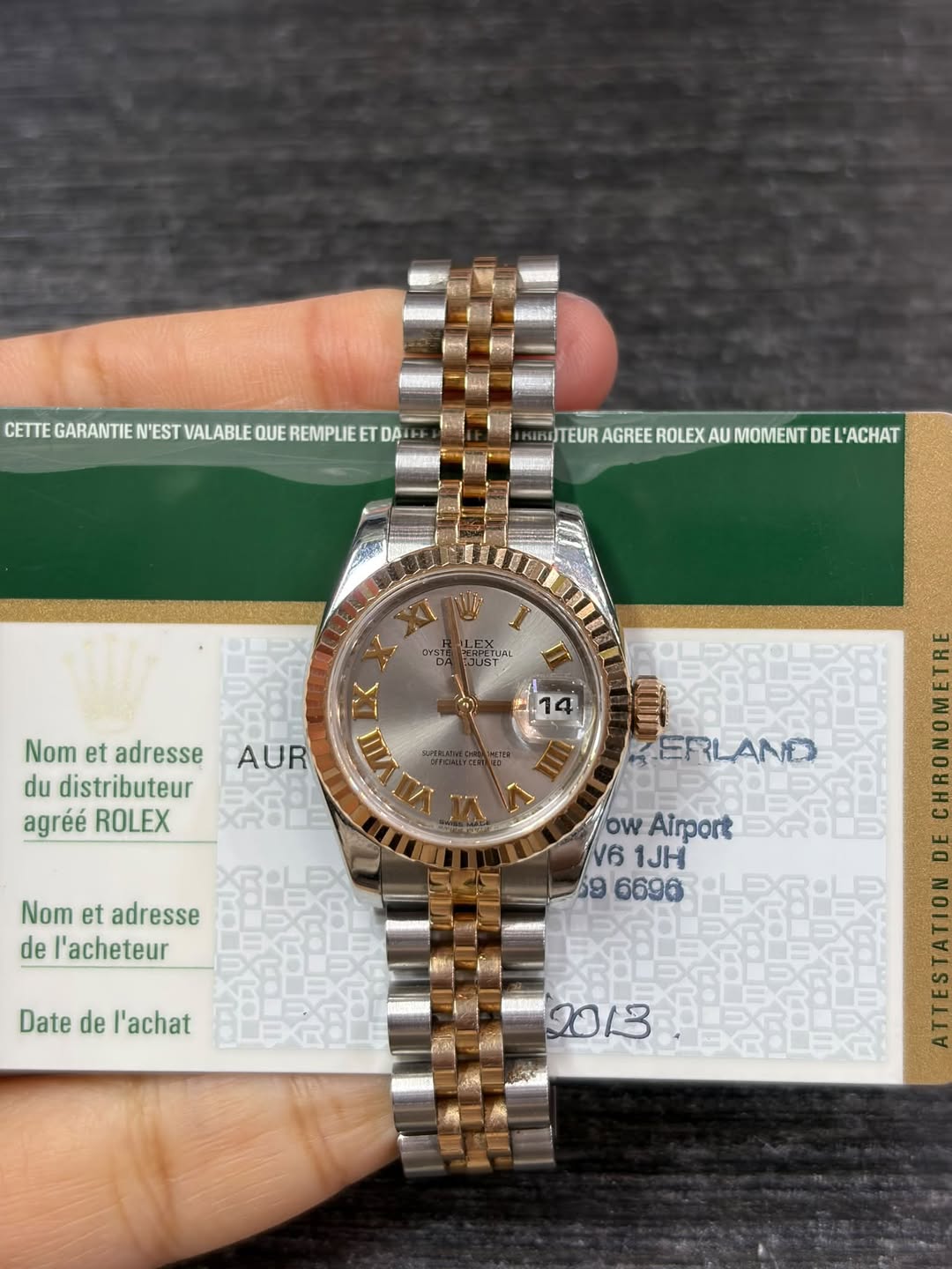 May be an image of wrist watch and text that says 'CETTE GARANTIE N'EST VALABLE QUE REMPLIEE ETEGARANTENESTALABEOUERERPU DA TEUR AGREE ROLEX WITEURAGREEROLEXAUMOMENTDELACHAT AU…