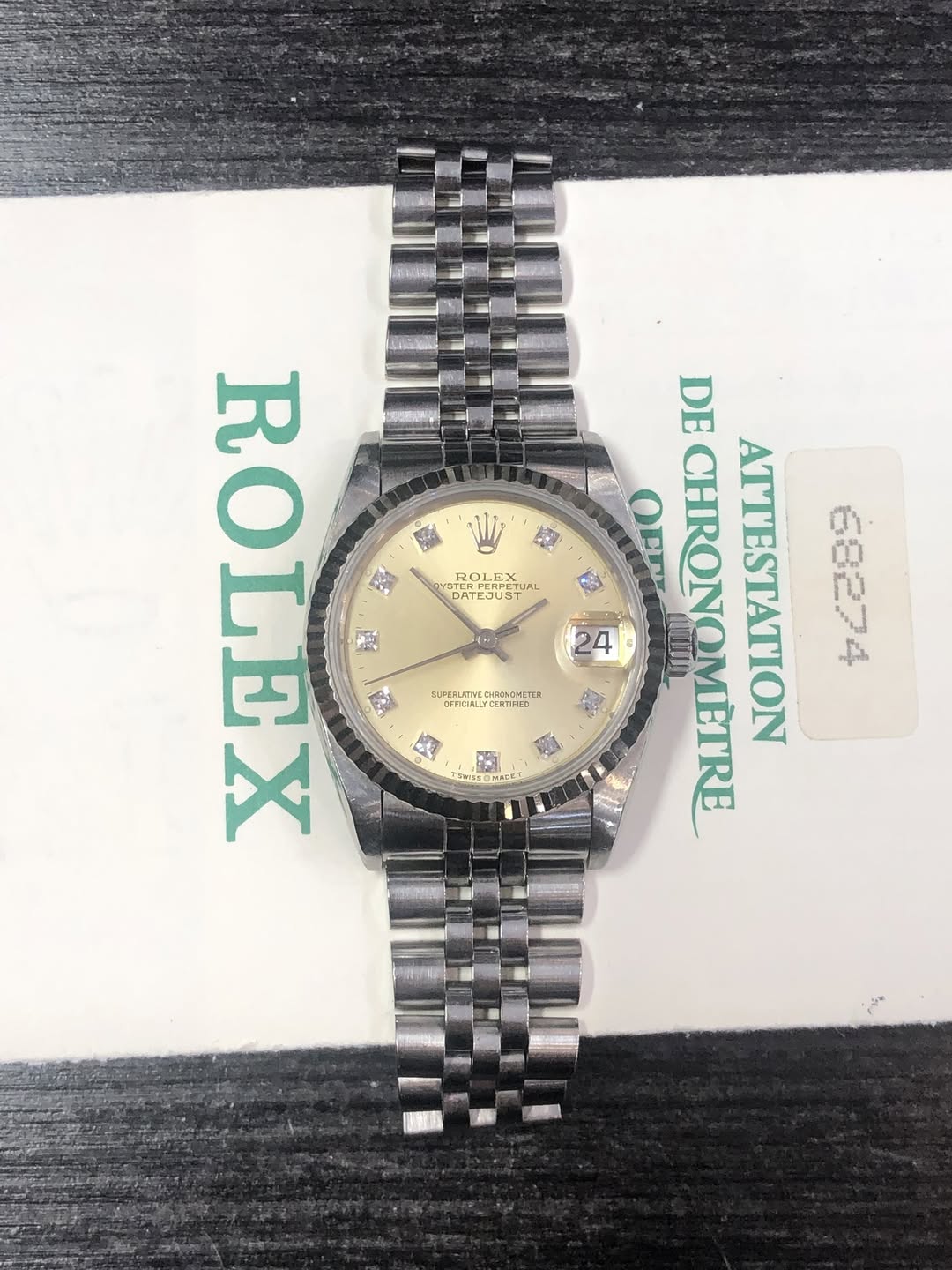 May be an image of wrist watch and text