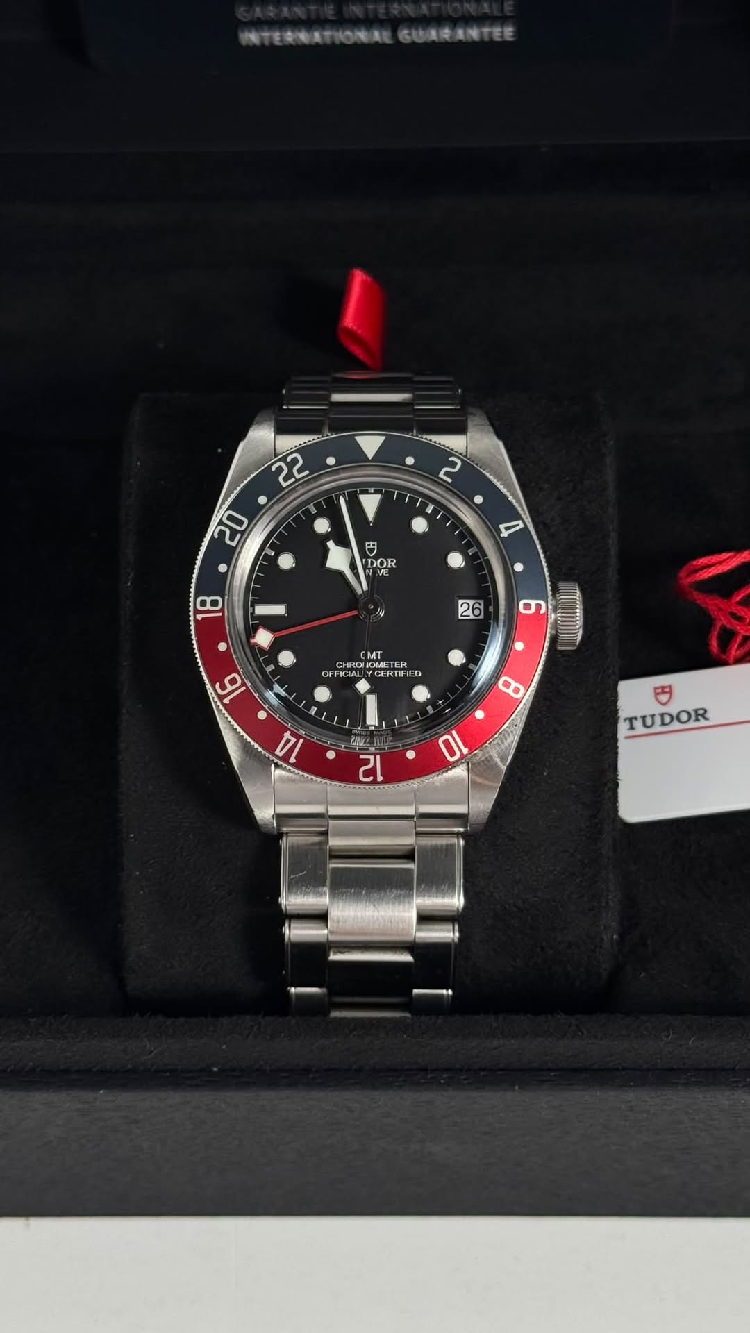 May be an image of wrist watch and text