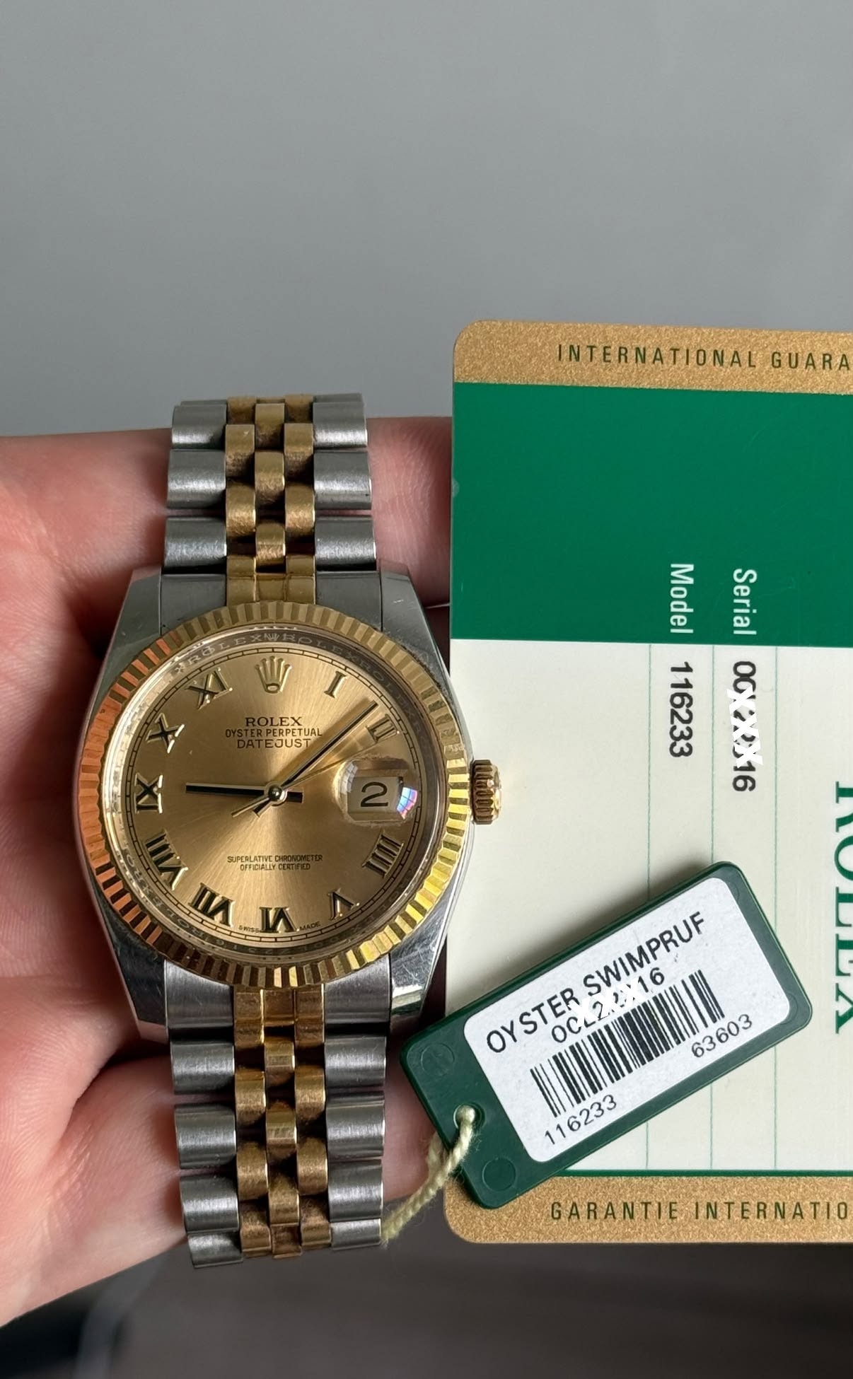 May be an image of wrist watch and text