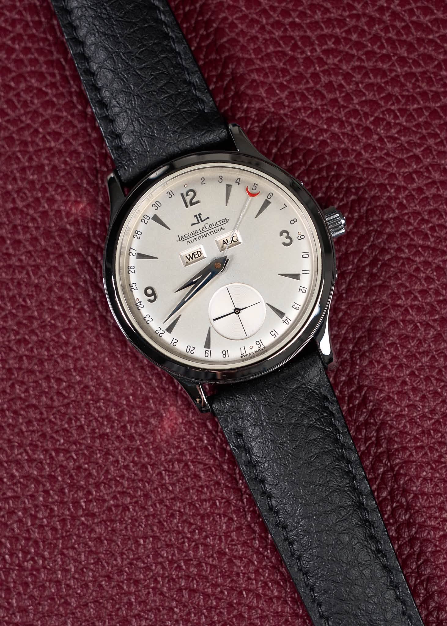 May be an image of wrist watch, leather and text