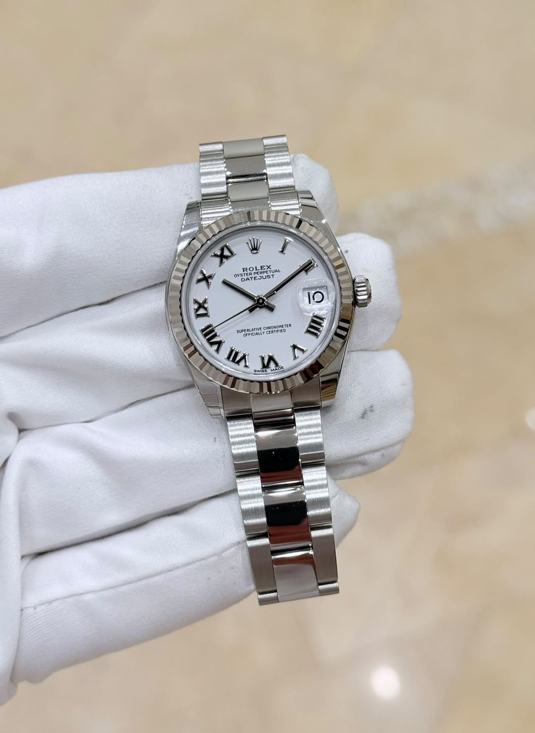 May be an image of wrist watch and text