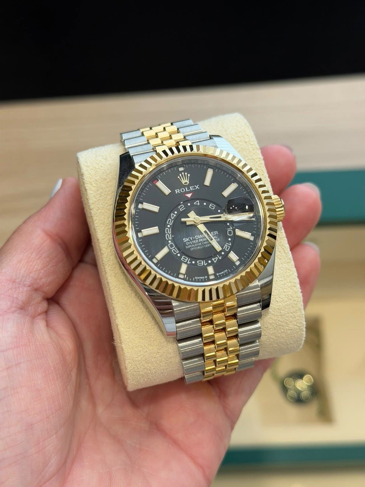 May be an image of wrist watch and text