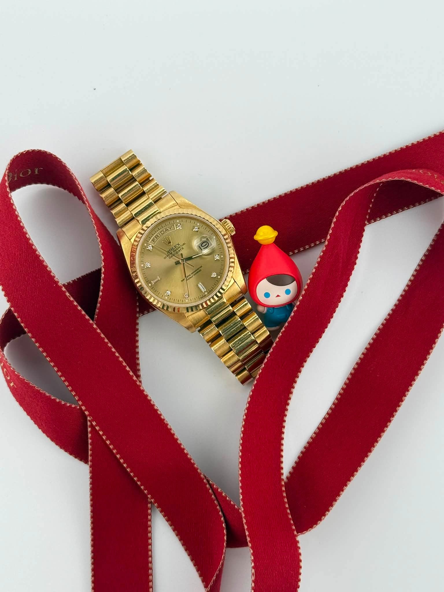 May be an image of wrist watch and text