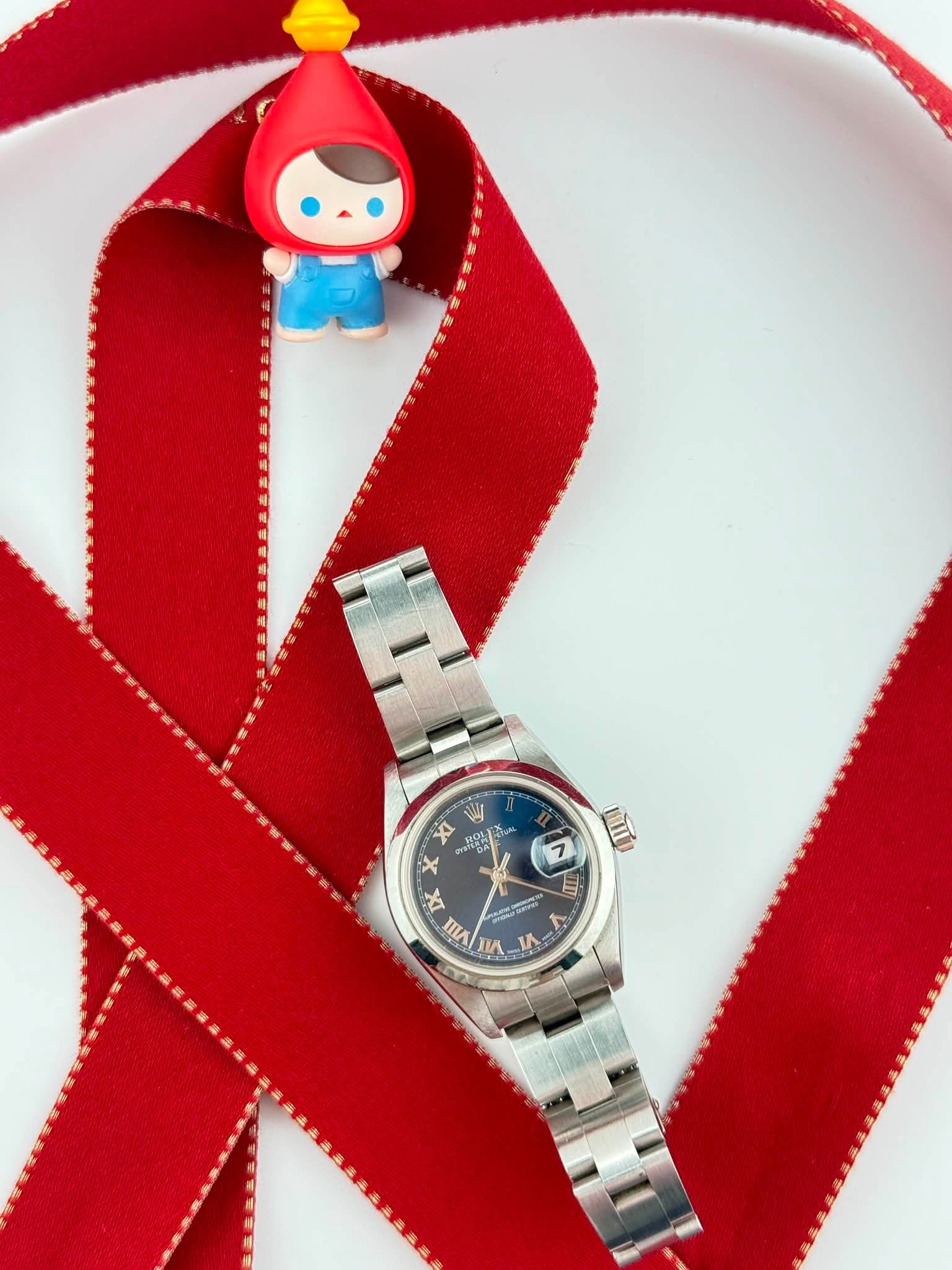 May be an image of wrist watch and text