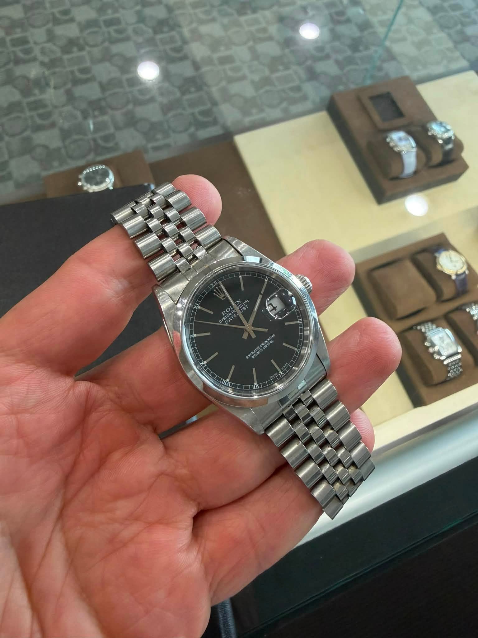 May be an image of wrist watch and text