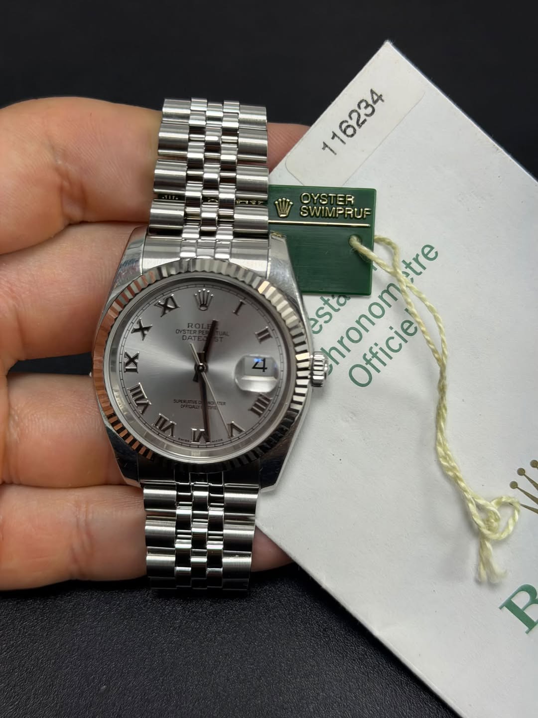 May be an image of wrist watch and text