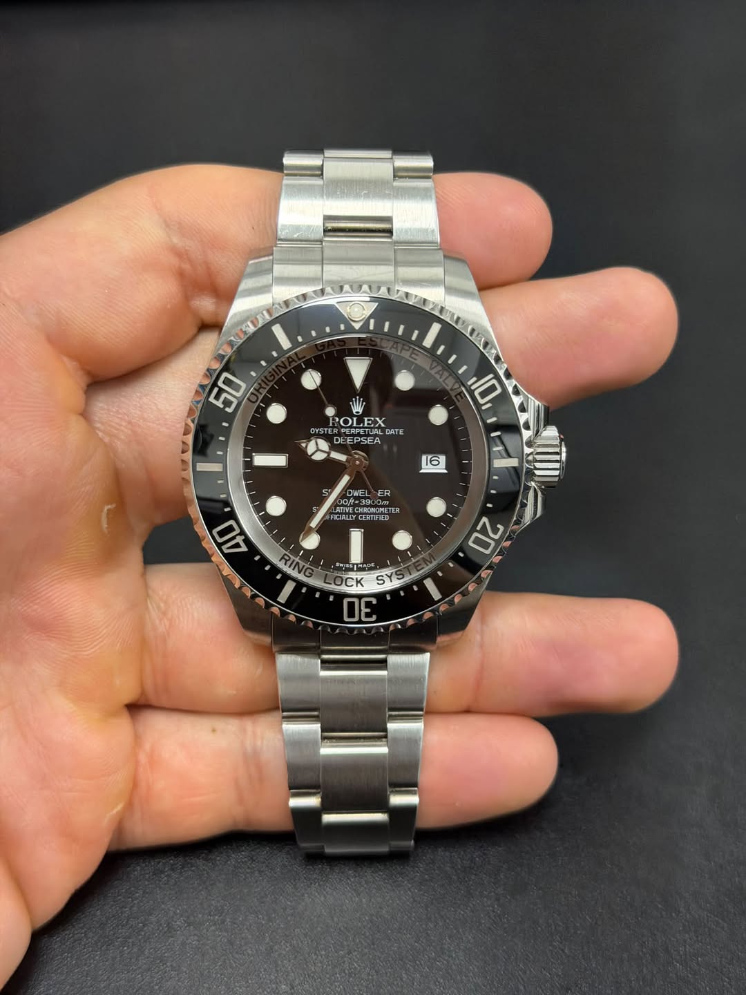 May be an image of wrist watch and text
