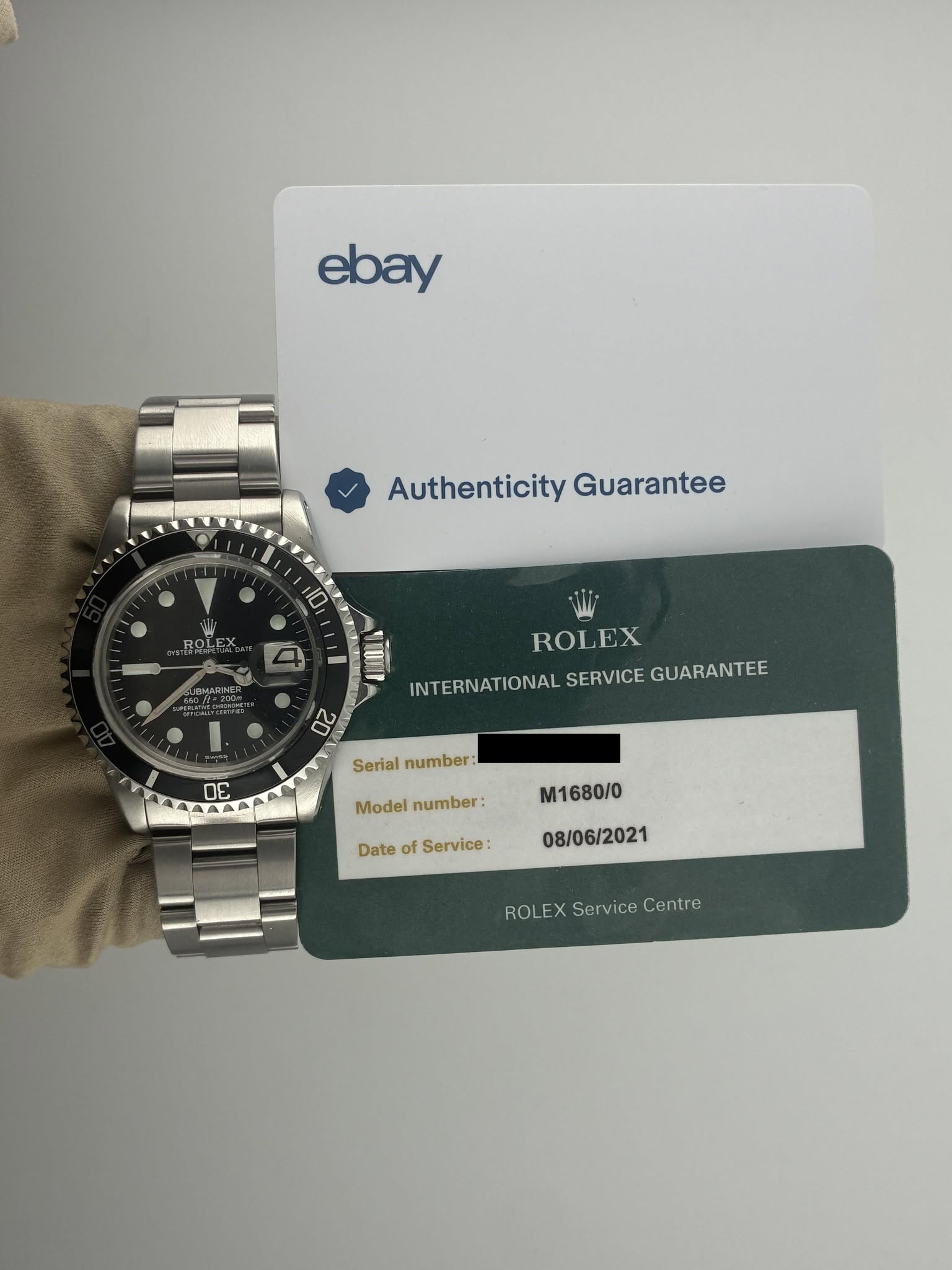 May be an image of wrist watch and text that says 'ebay Authenticity AuthenticityGuarantee Guarantee 10 ROLEX .oλτι JBWARNER .品技.. LuTir INTERNATIONAL SERVICE GUARANTEE ROLEX 20 ΠΕ…