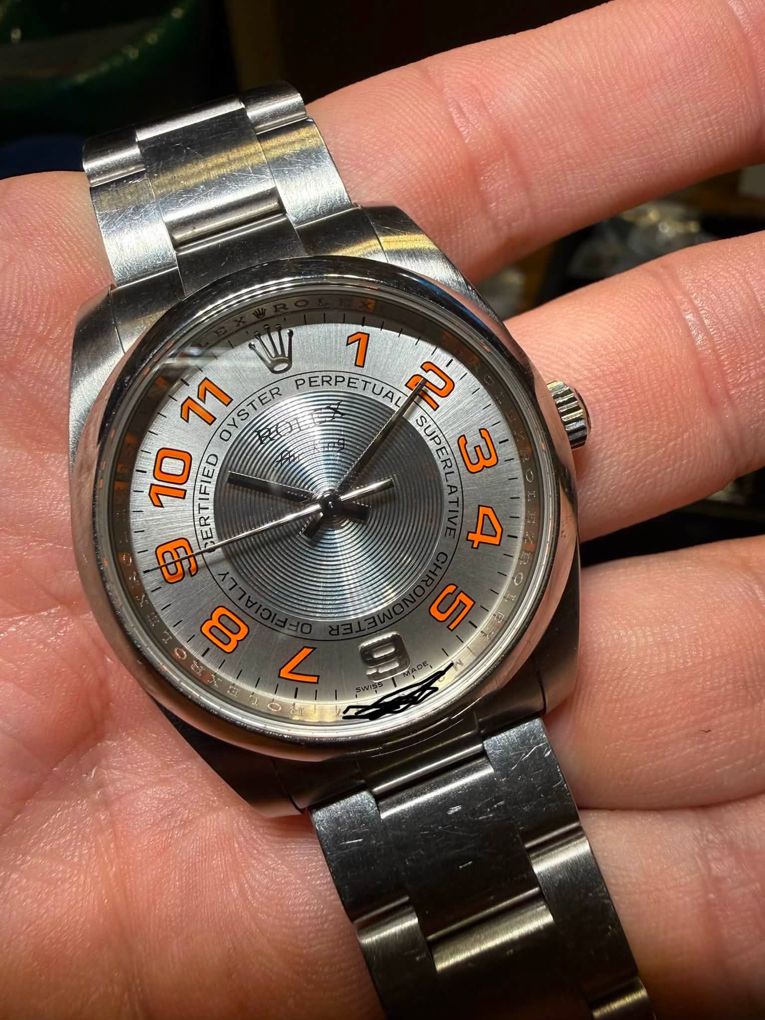 May be an image of wrist watch and text that says 'W 1 11 OYSTER ョフ ER PERPETUAL ב IFIED BERTIFIED ERTIFIED ER SUPERLA SUP 3 9 9 10 F ሚ 5 s O 00 L ロ量'