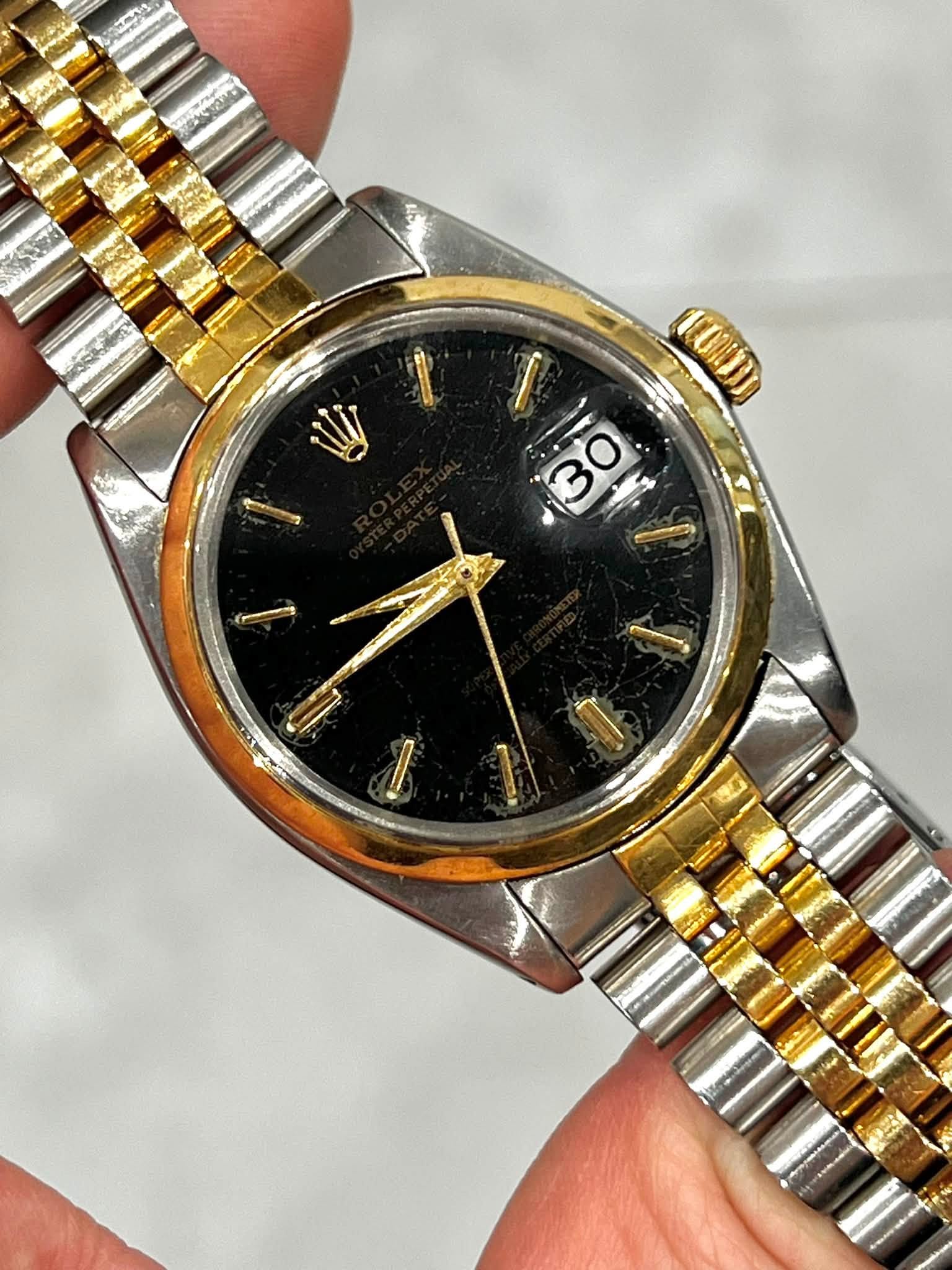 May be an image of wrist watch and text