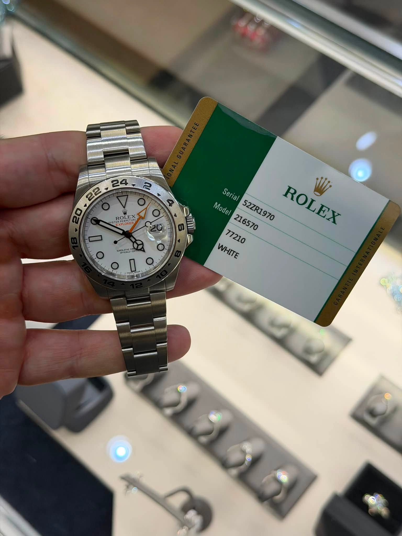 May be an image of wrist watch and text that says ' o ROLEX NAEN れさい TERCINES - T Seria Model 216570 Model216570 52ZR1970 ROLEX WI 77210 WHITE ਦয়র o I O'
