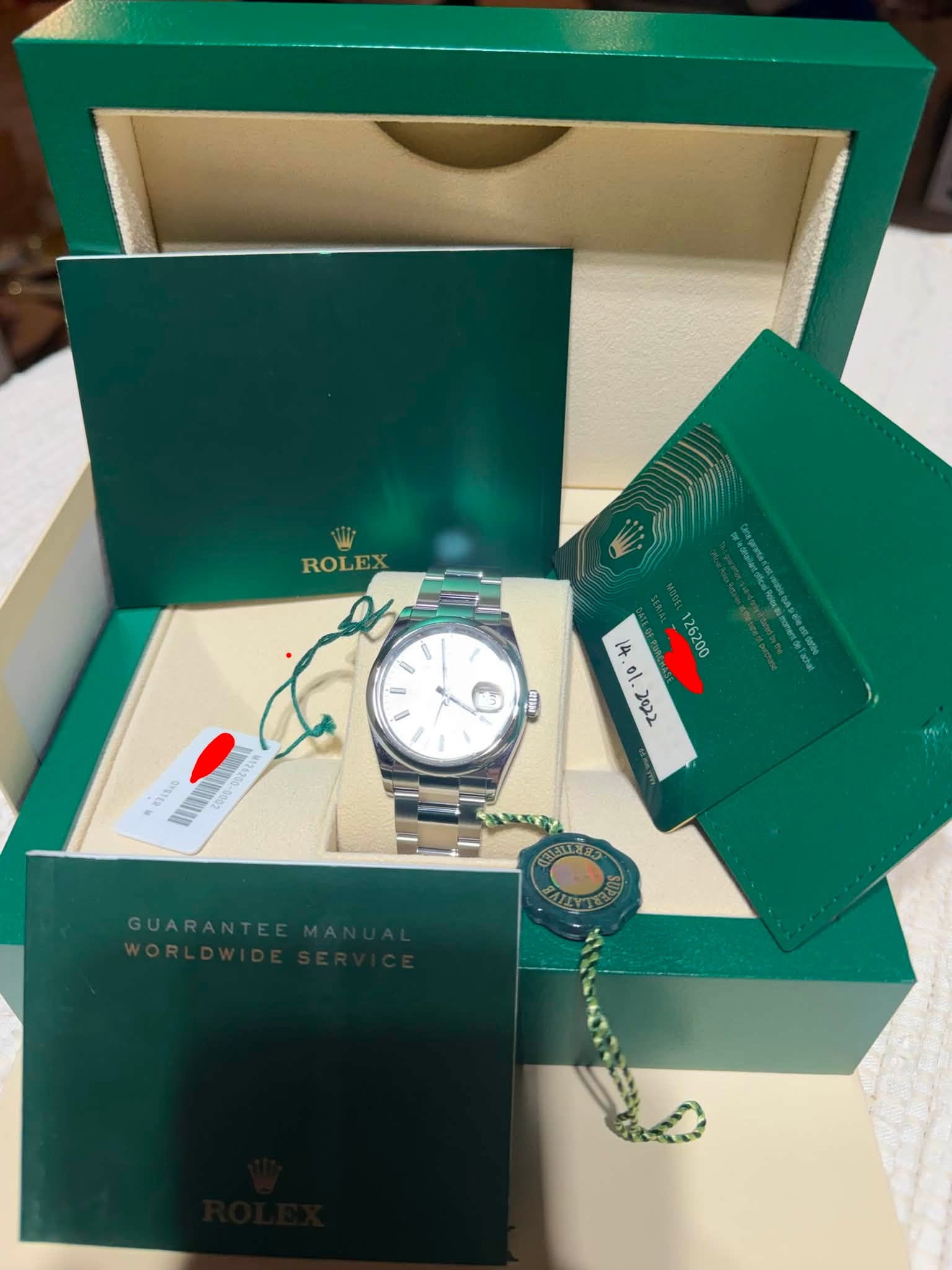 May be an image of wrist watch and text