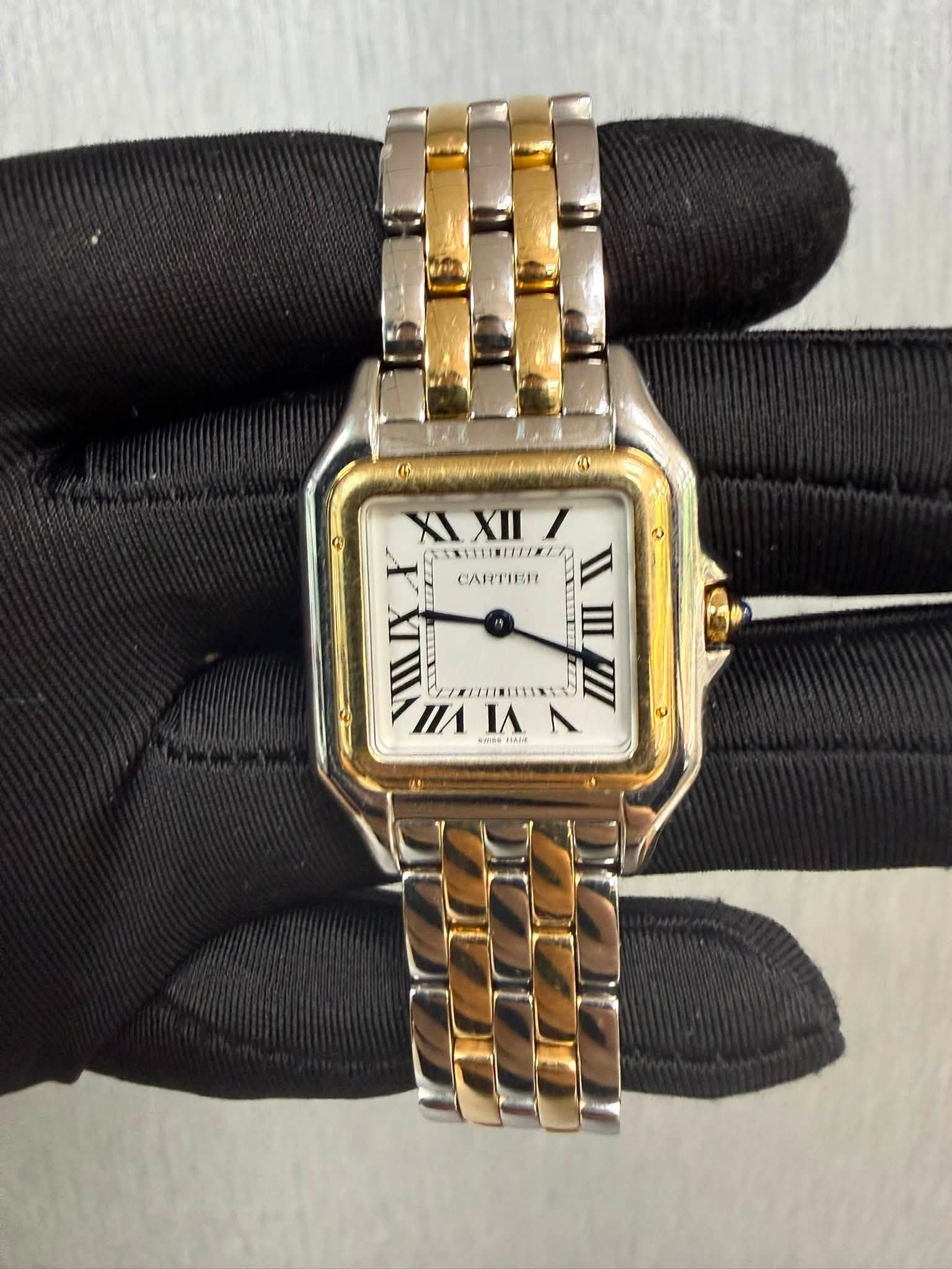 May be an image of wrist watch and text