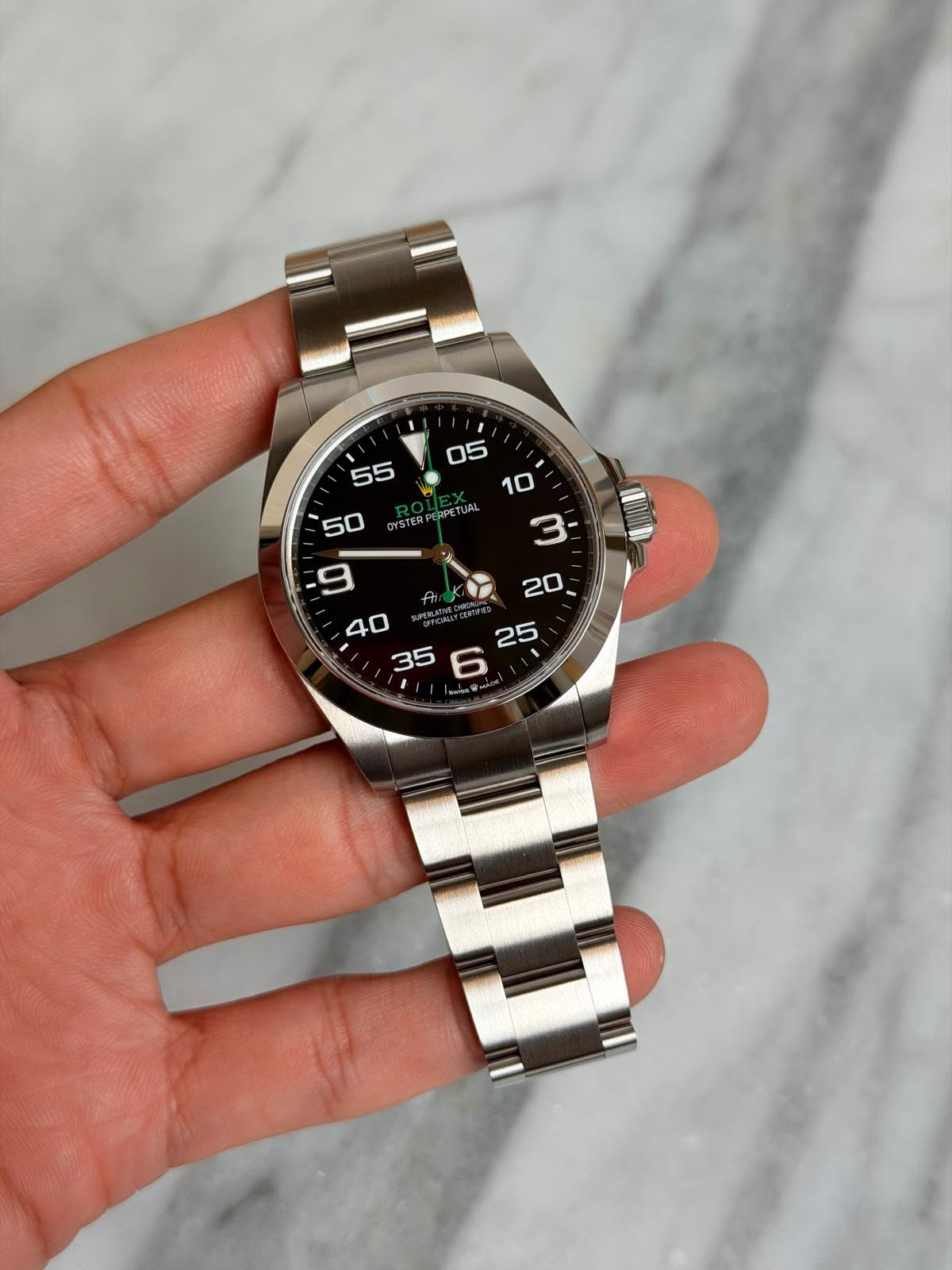 May be an image of wrist watch and text