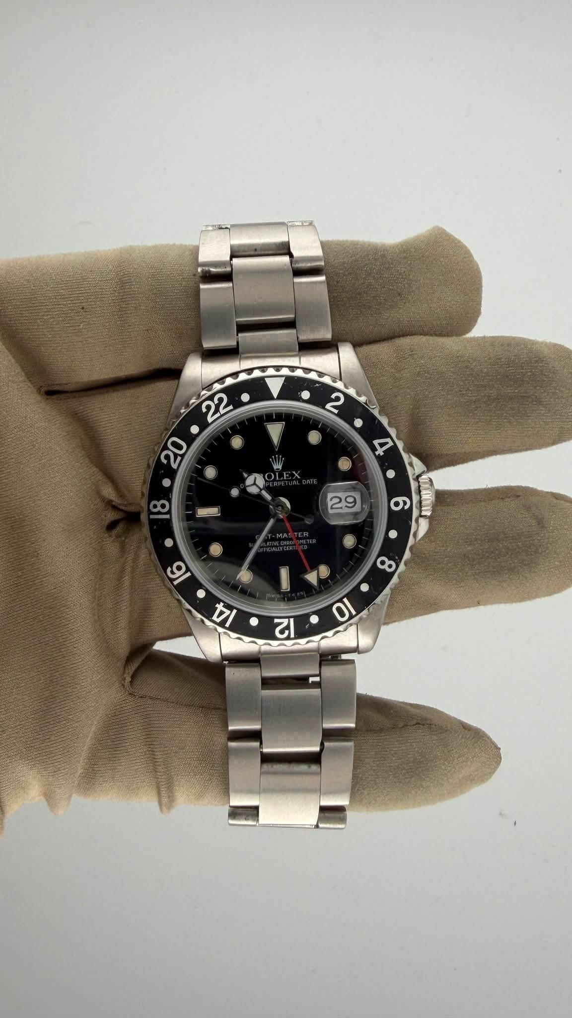 May be an image of wrist watch and text