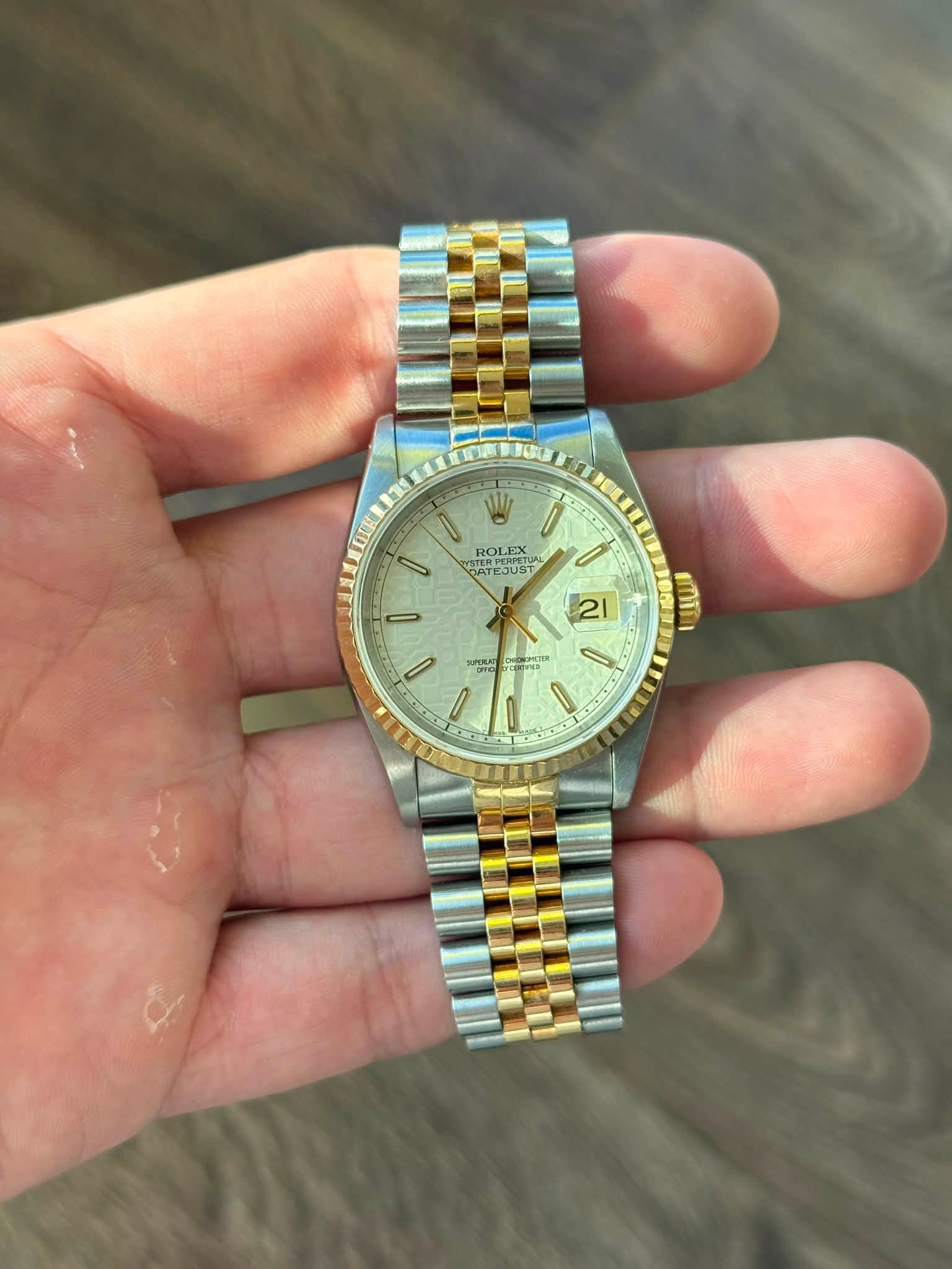 May be an image of wrist watch and text