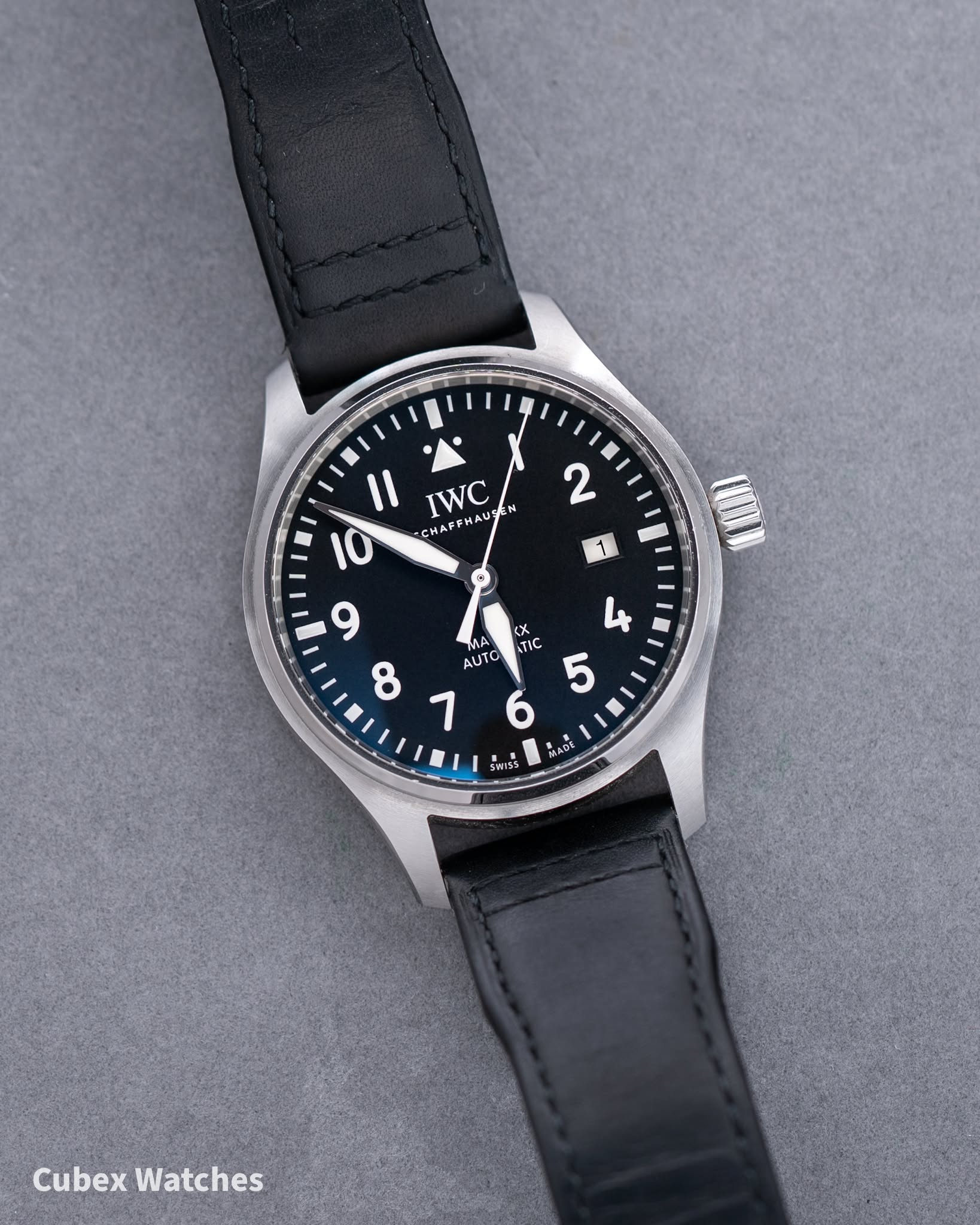 May be an image of wrist watch and text that says '2 1 1 I1 IWC HAUS N 10 HAL -CHA 9 <X MA ما TIC TIC 5 8 AUTO 1 แน 6 ADE HISS Cubex Watches'