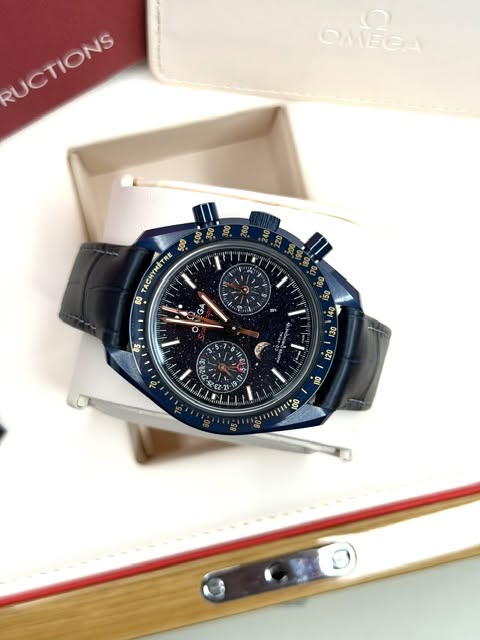 May be an image of wrist watch and text that says '0 OMEGA UCTIONG RUCTIONS TACHYMETRE TRE 60 شG 9 ω 65 O 1 130 에 מנן T0 ባን 家 ナ D 120 -٠ RI0 oorpaa1юo J00'