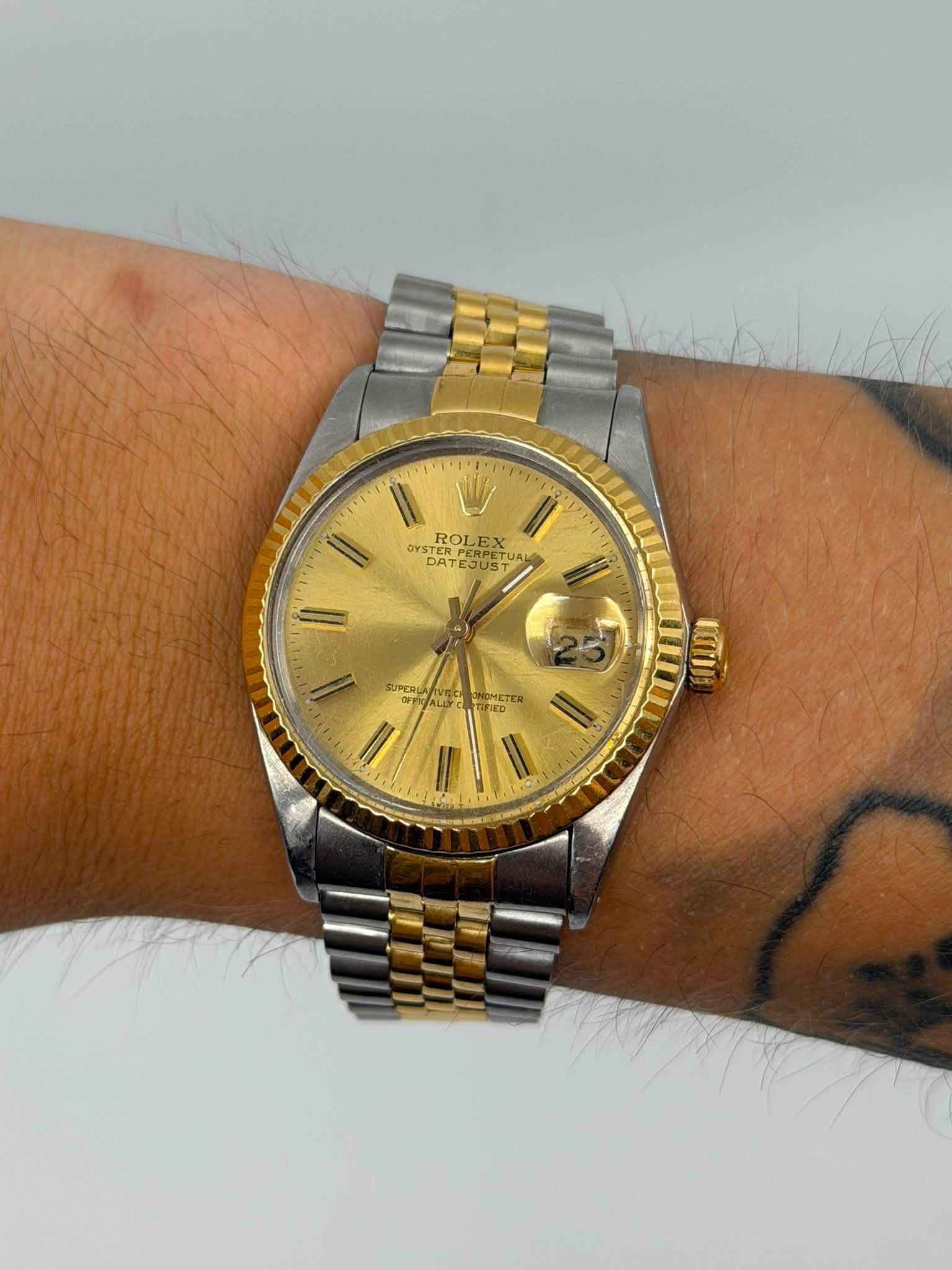 May be an image of wrist watch and text