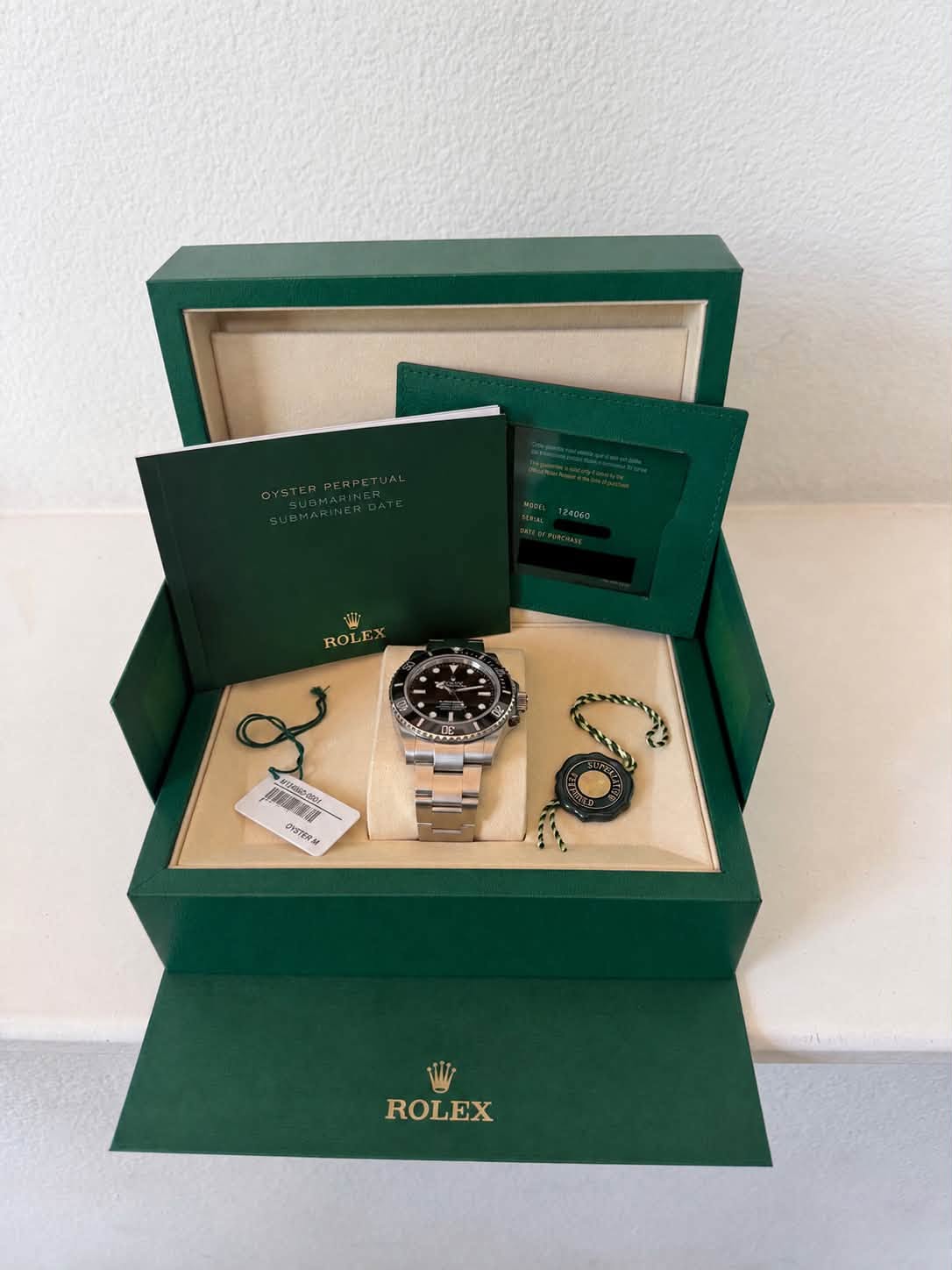 May be an image of wrist watch and text that says 'ROLF مع ORSTER W ROLEX'